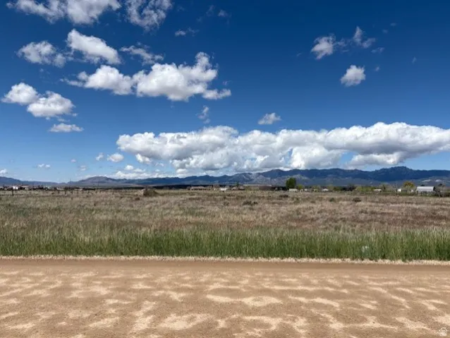 View of mountain backdrop featuring rural landscape