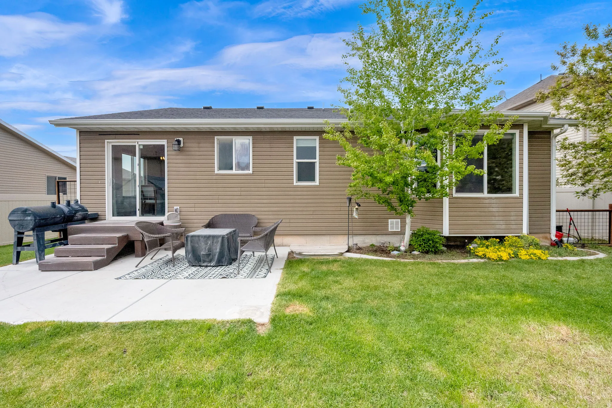 Rear view of property with a patio area