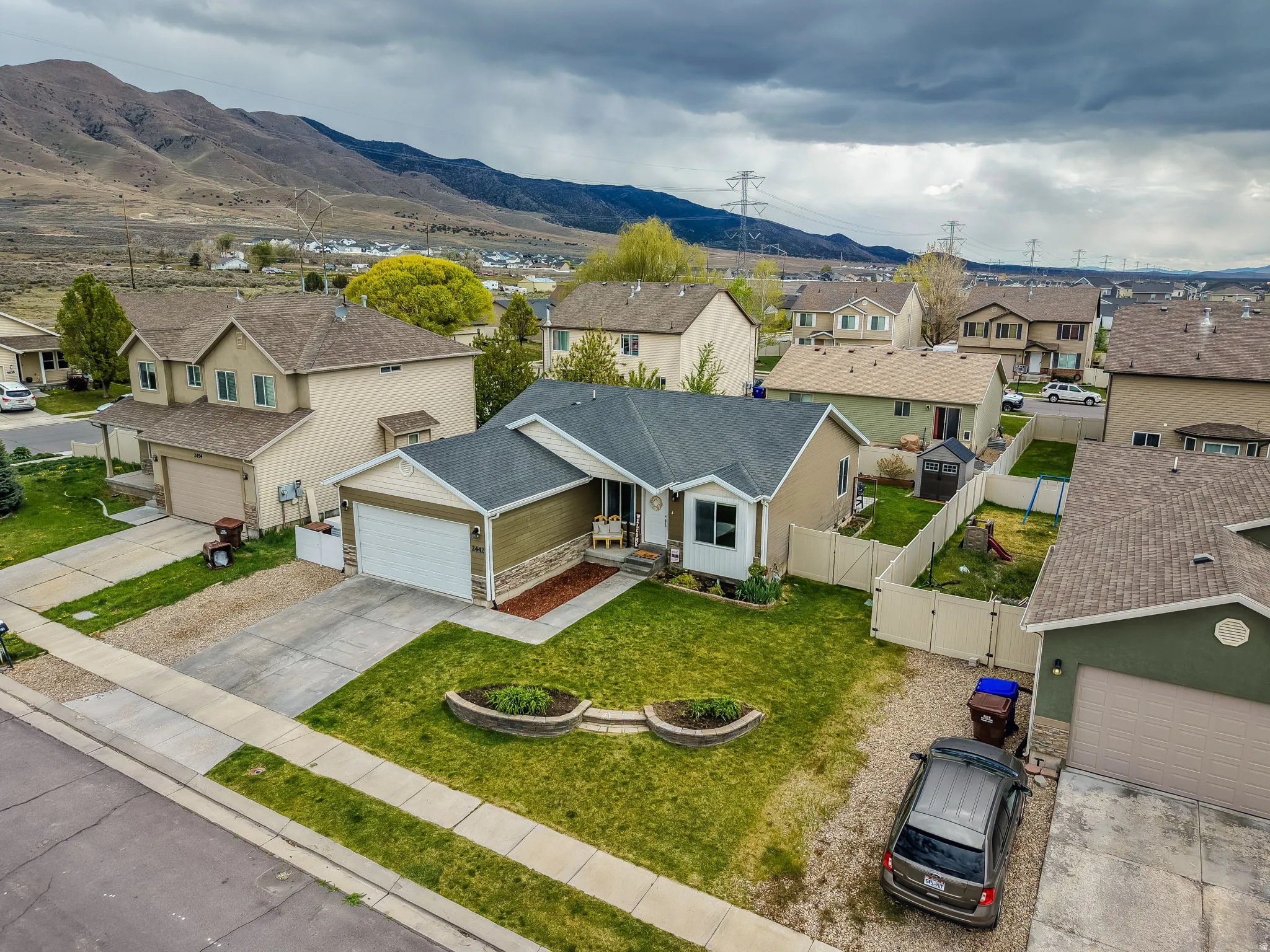 Aerial perspective of suburban area featuring a mountain backdrop