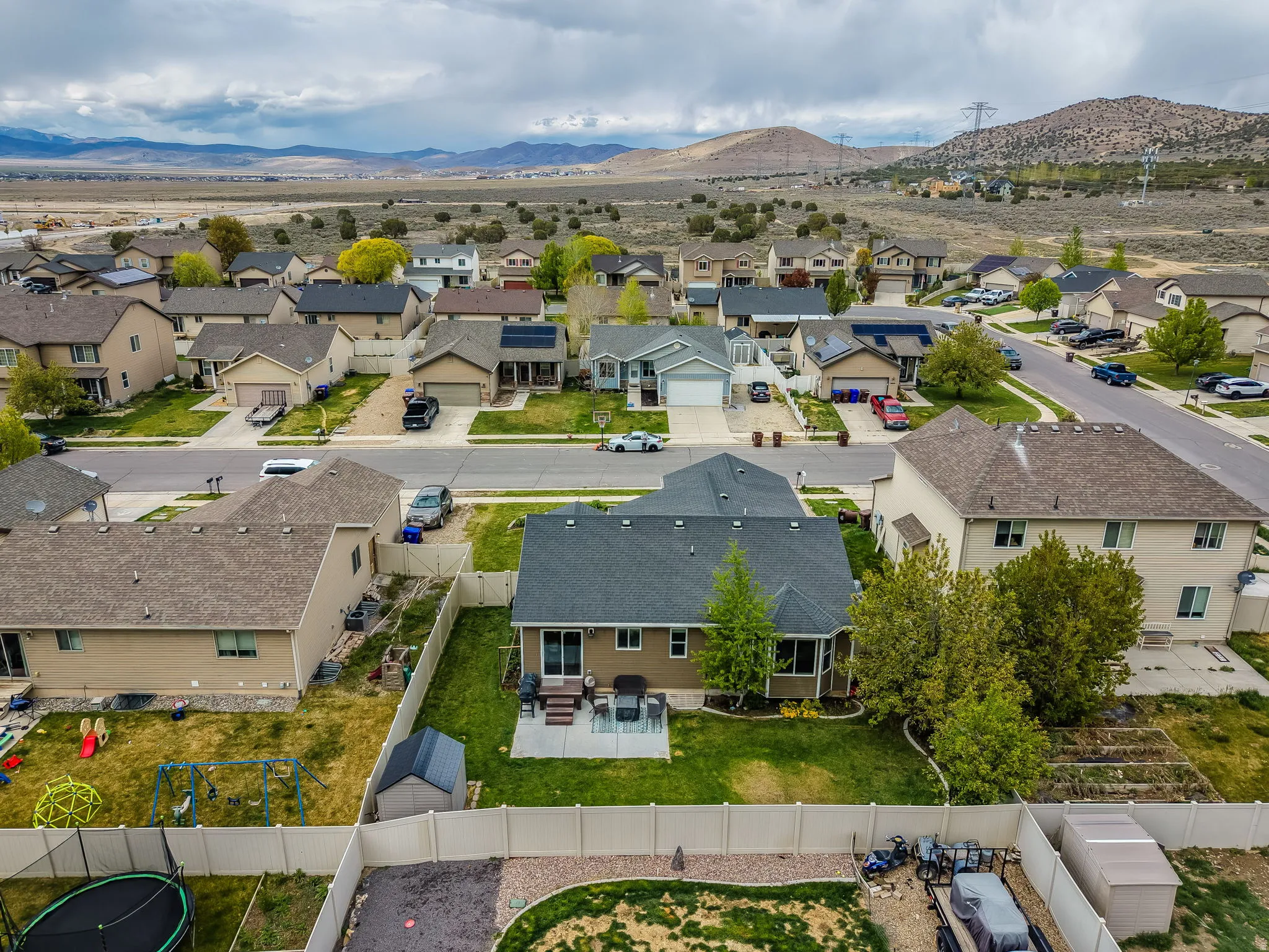 Aerial view of residential area featuring a mountainous background