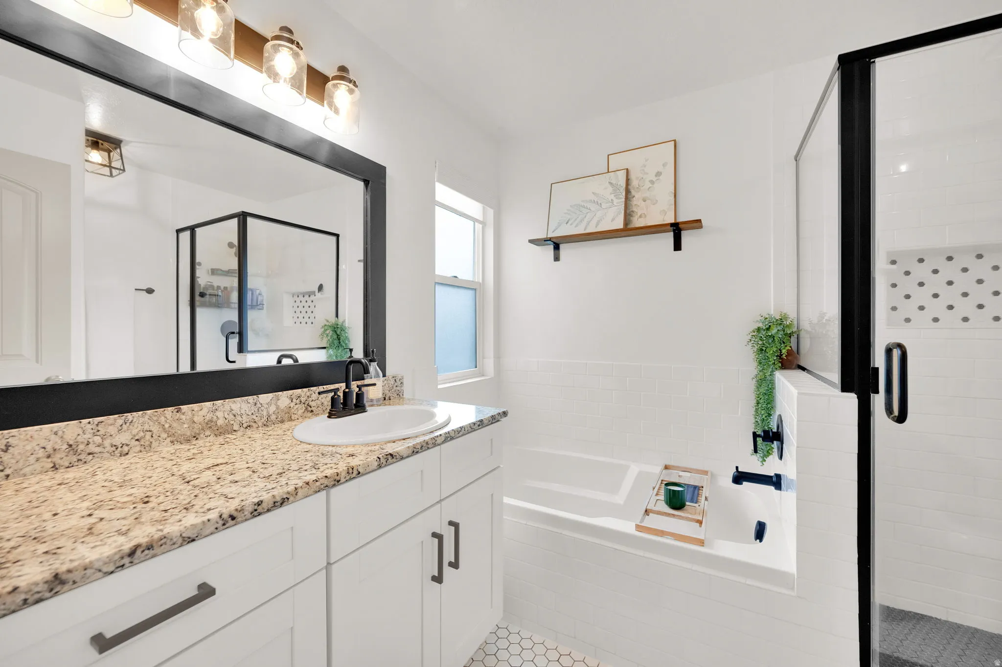 Bathroom with vanity, a shower stall, and a bath
