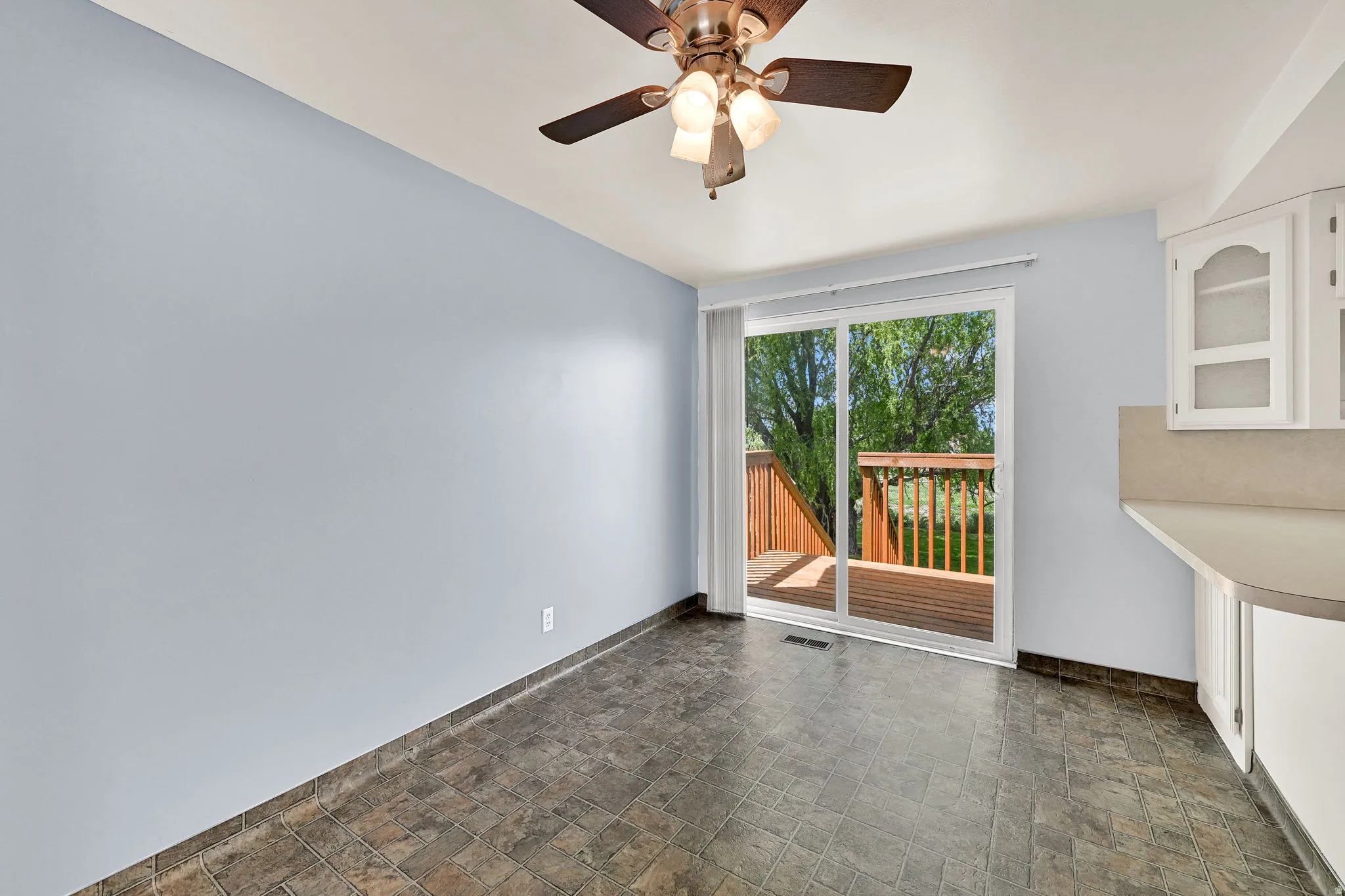 Dining area with sliding door to brand new deck
