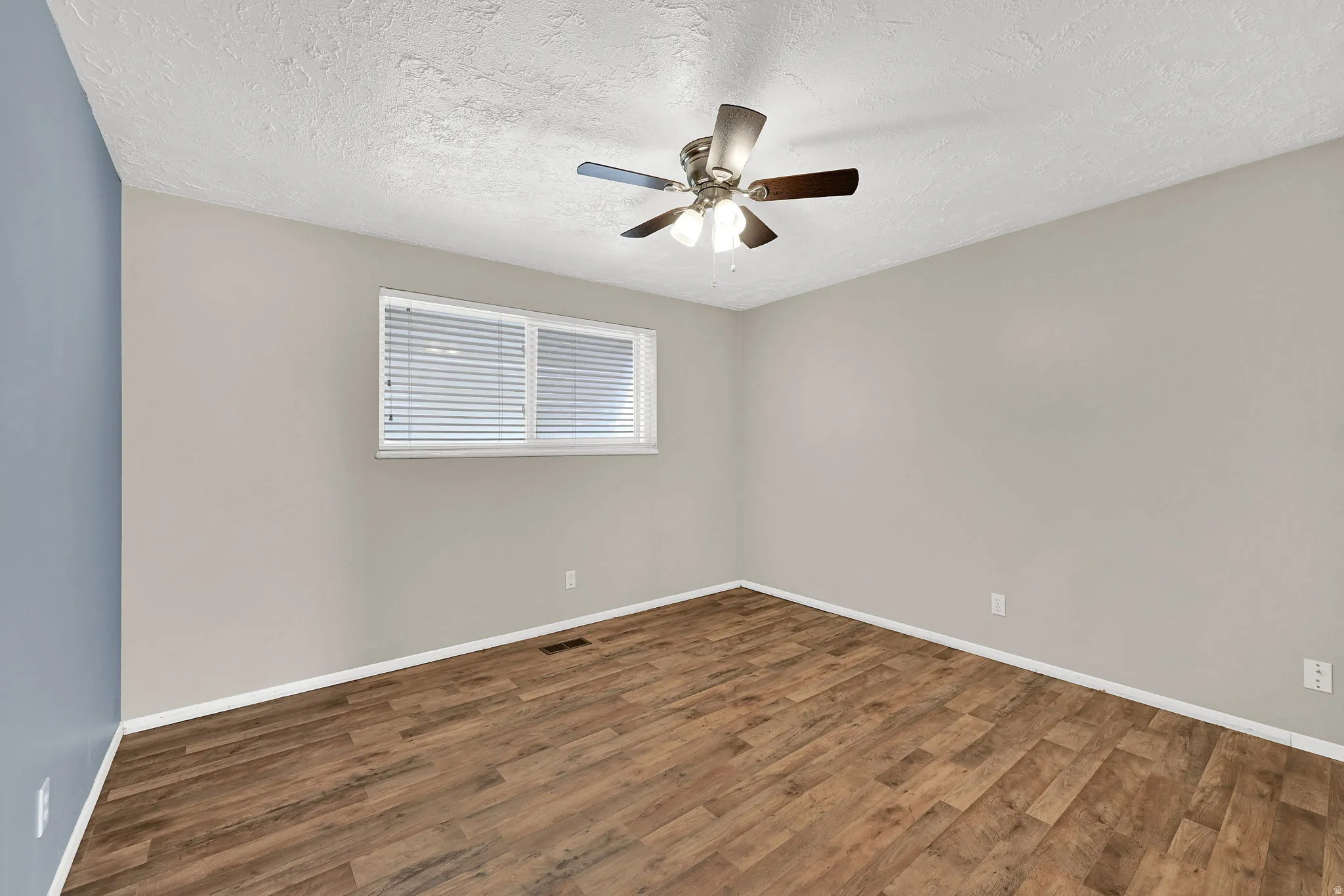 Large bedroom with ceiling fan