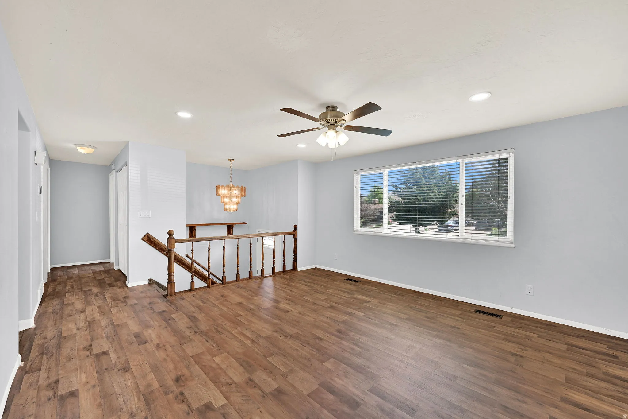 Spacious Living/Family room with new flooring and  newer vinyl windows