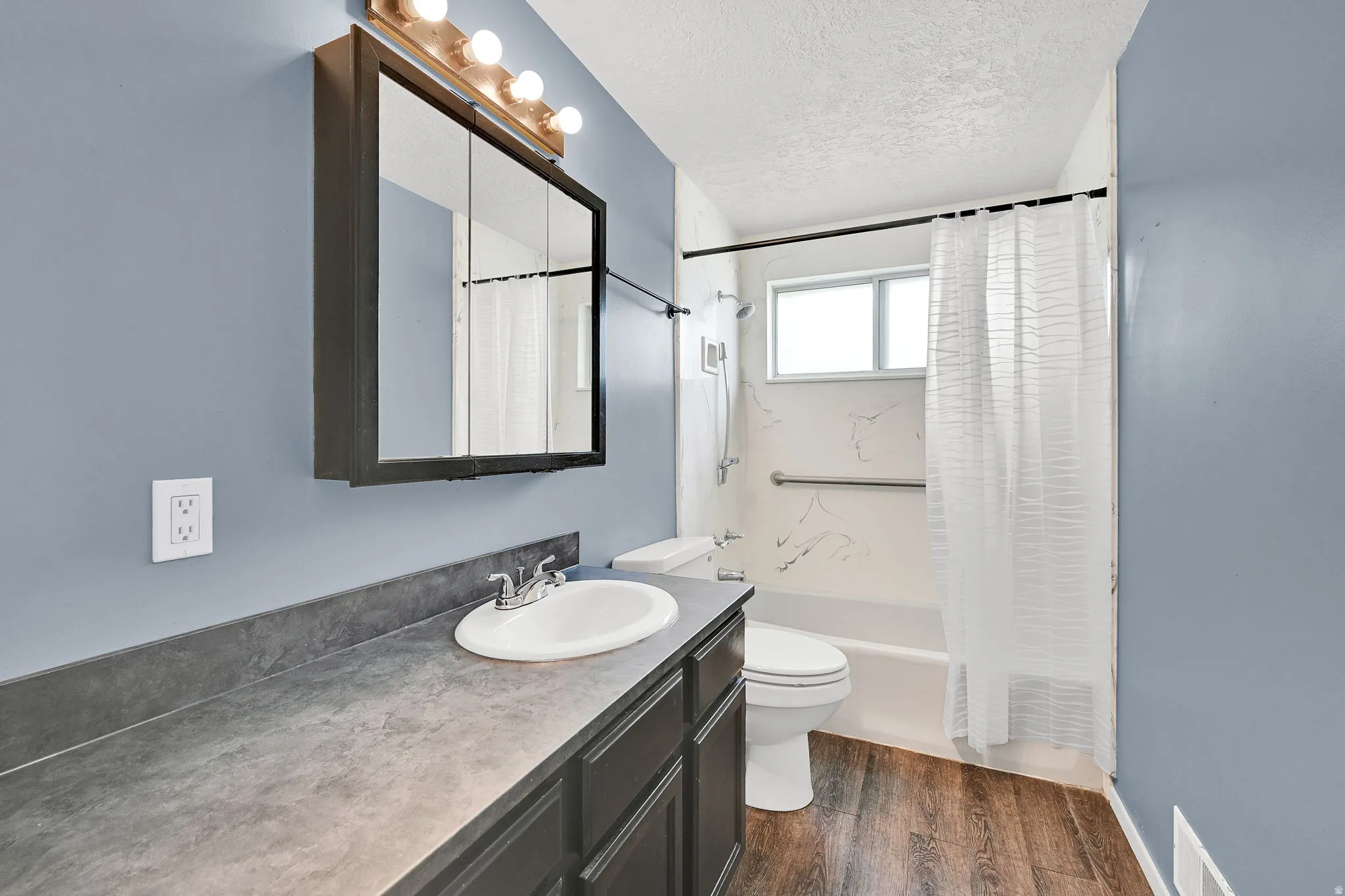 Bath features new countertop and sink