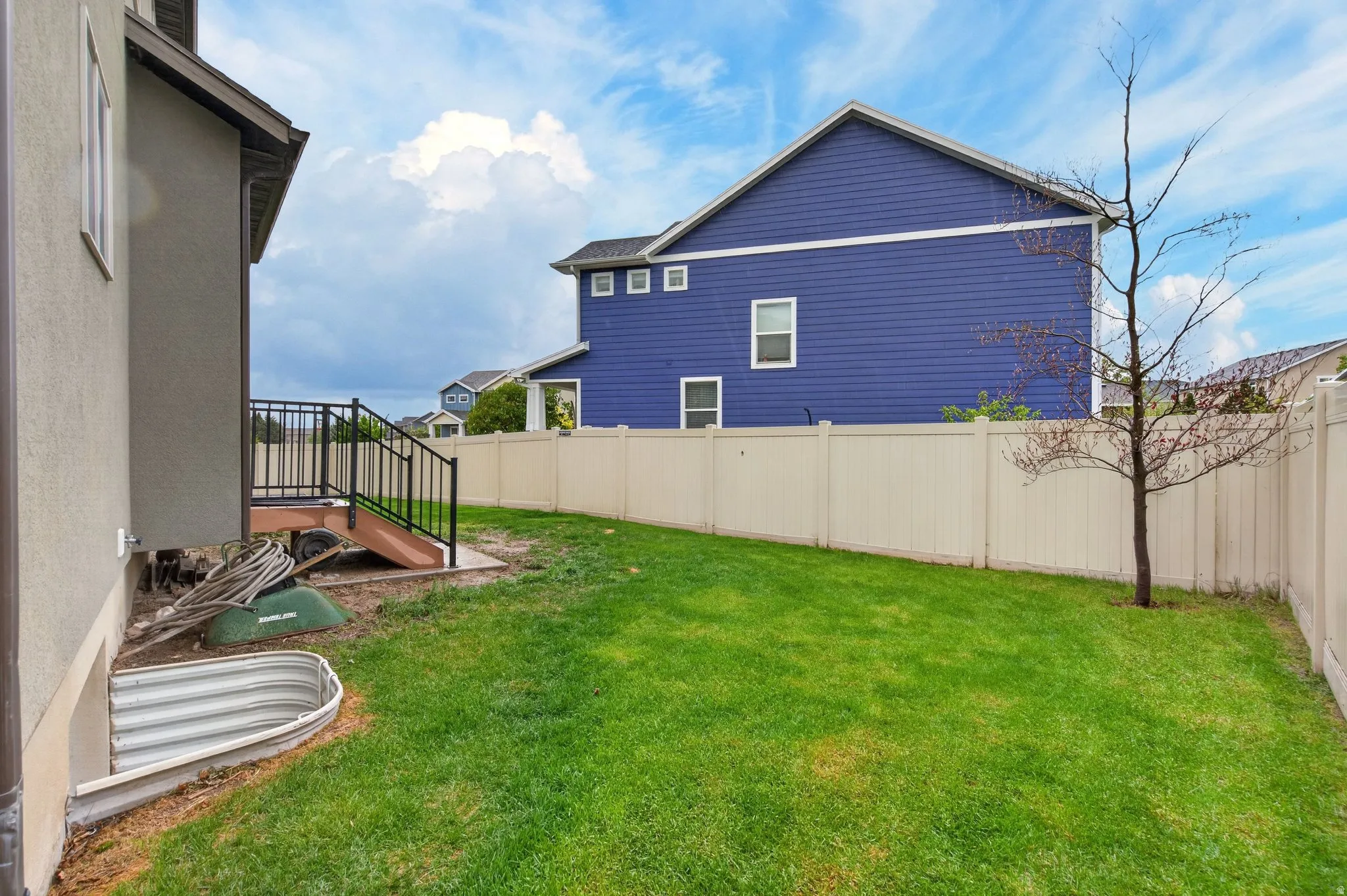 View of fenced backyard