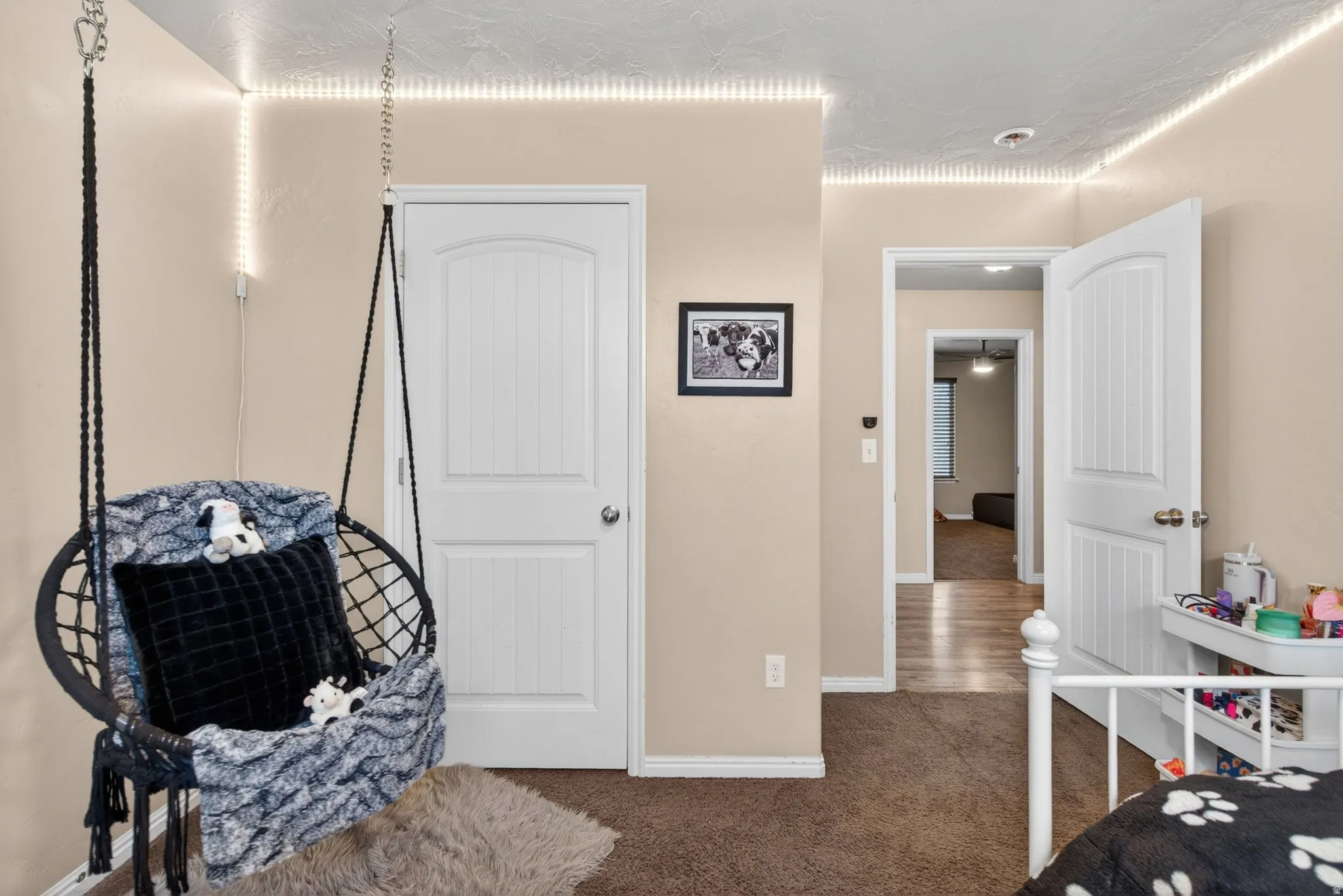 Bedroom with dark carpet and a closet