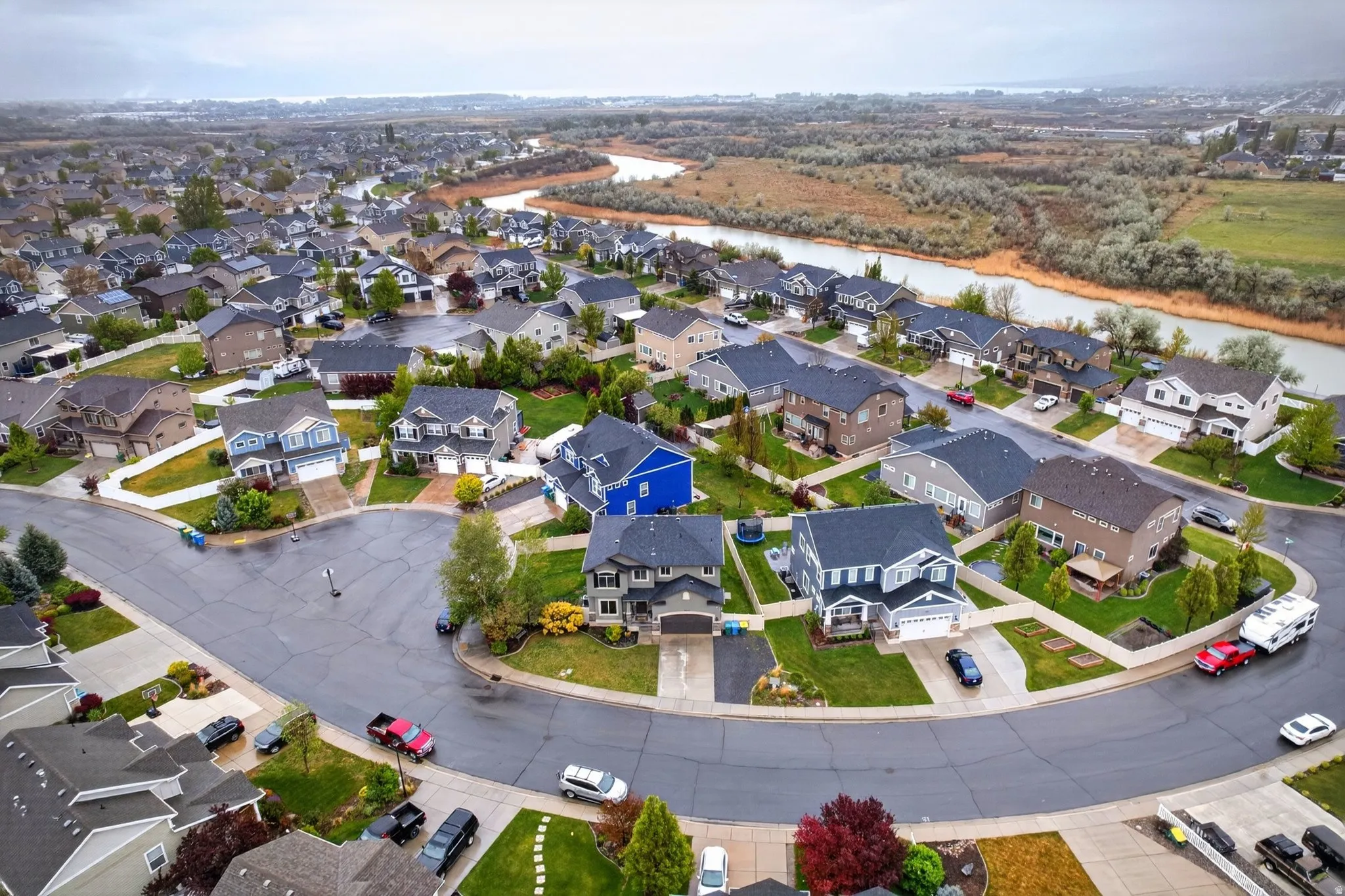 Aerial perspective of suburban area with a large body of water