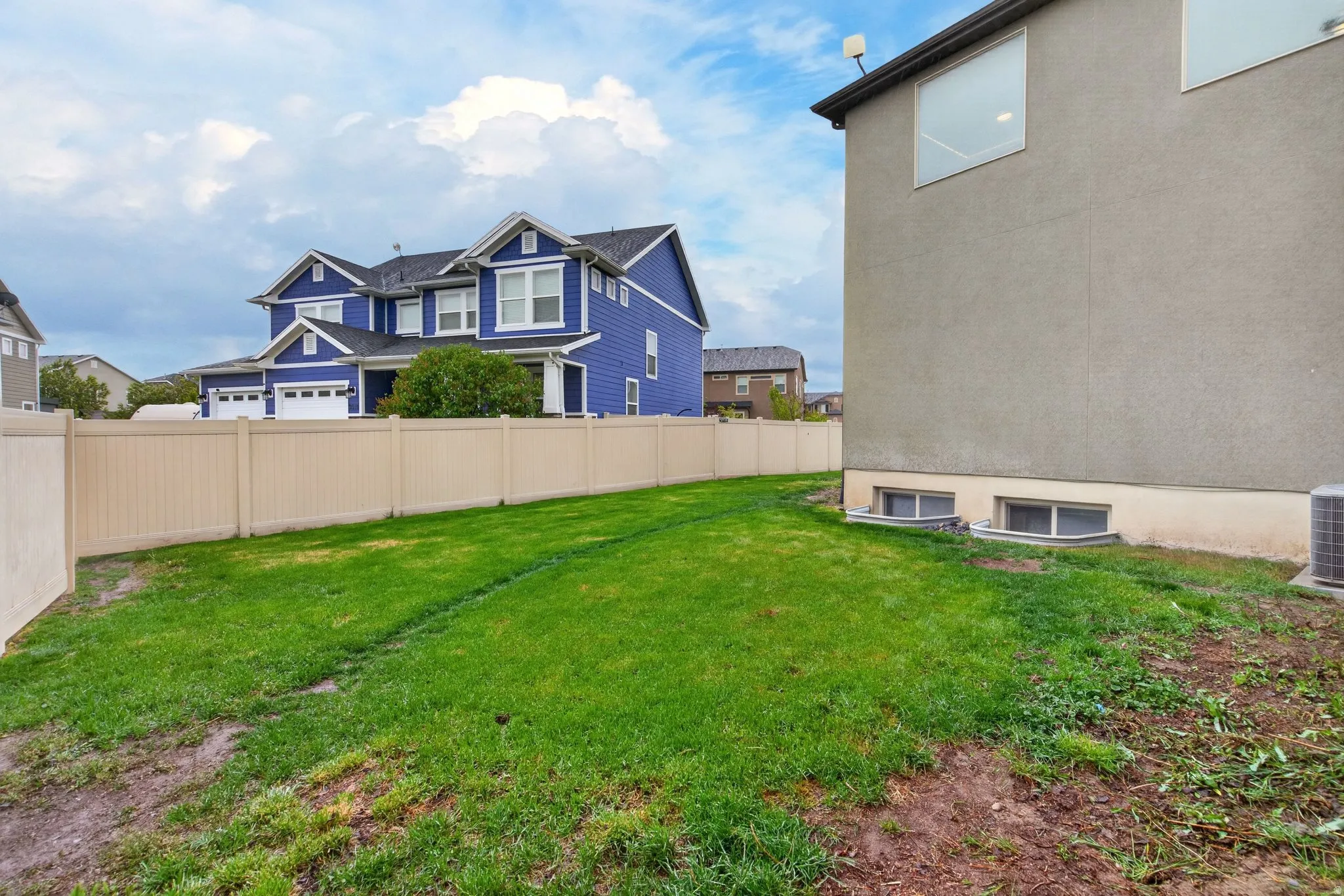 View of fenced backyard