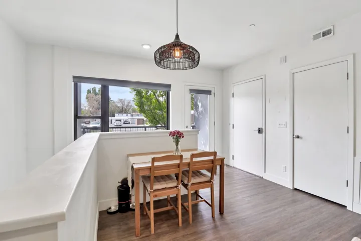 Dining room with dark wood-style floors
