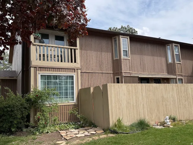 View of property exterior with a balcony