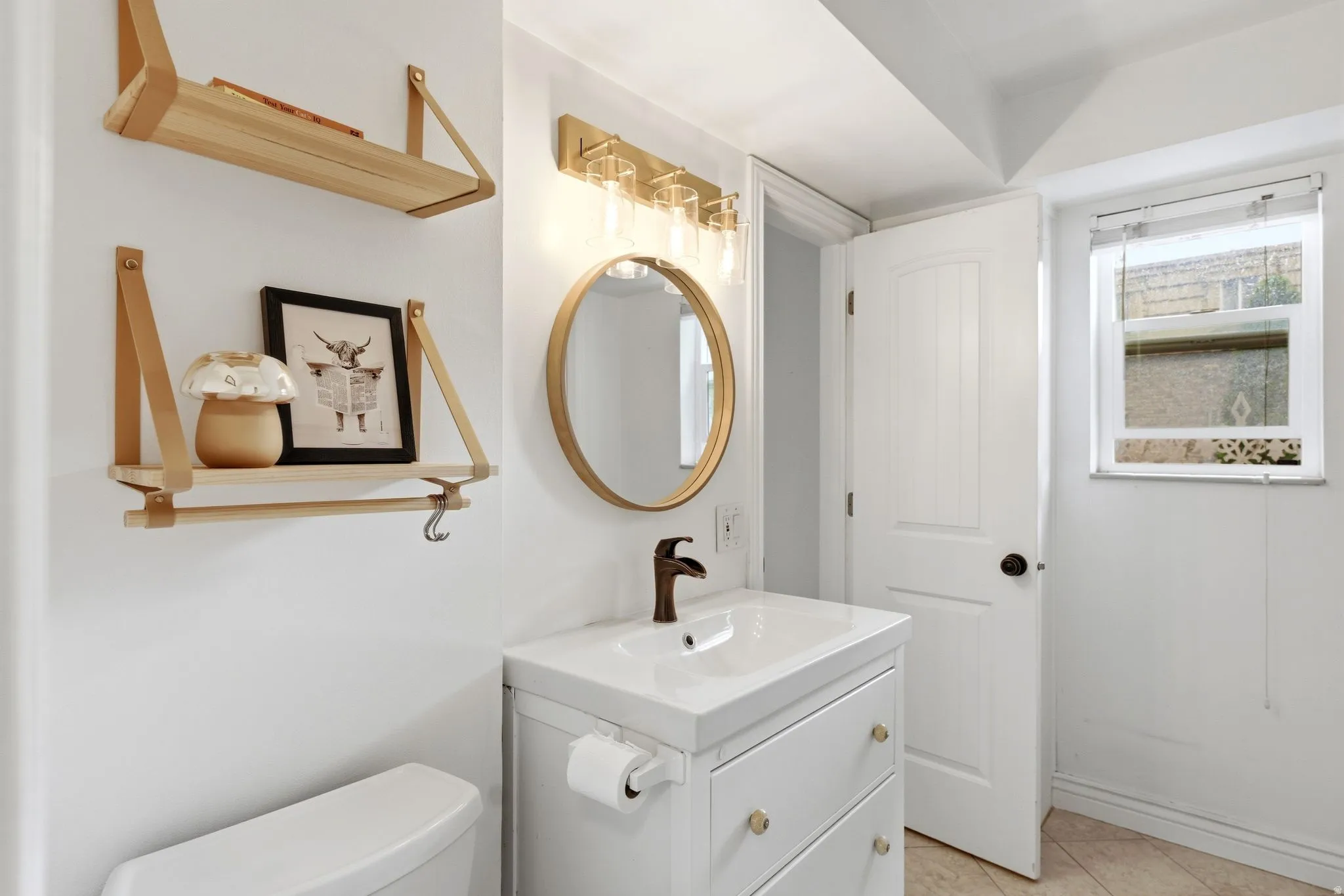 Bathroom with vanity and light tile patterned flooring