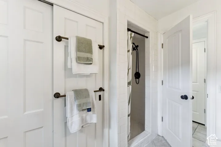Full bath with a shower stall