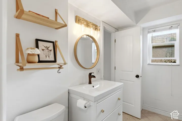 Bathroom with vanity and light tile patterned flooring