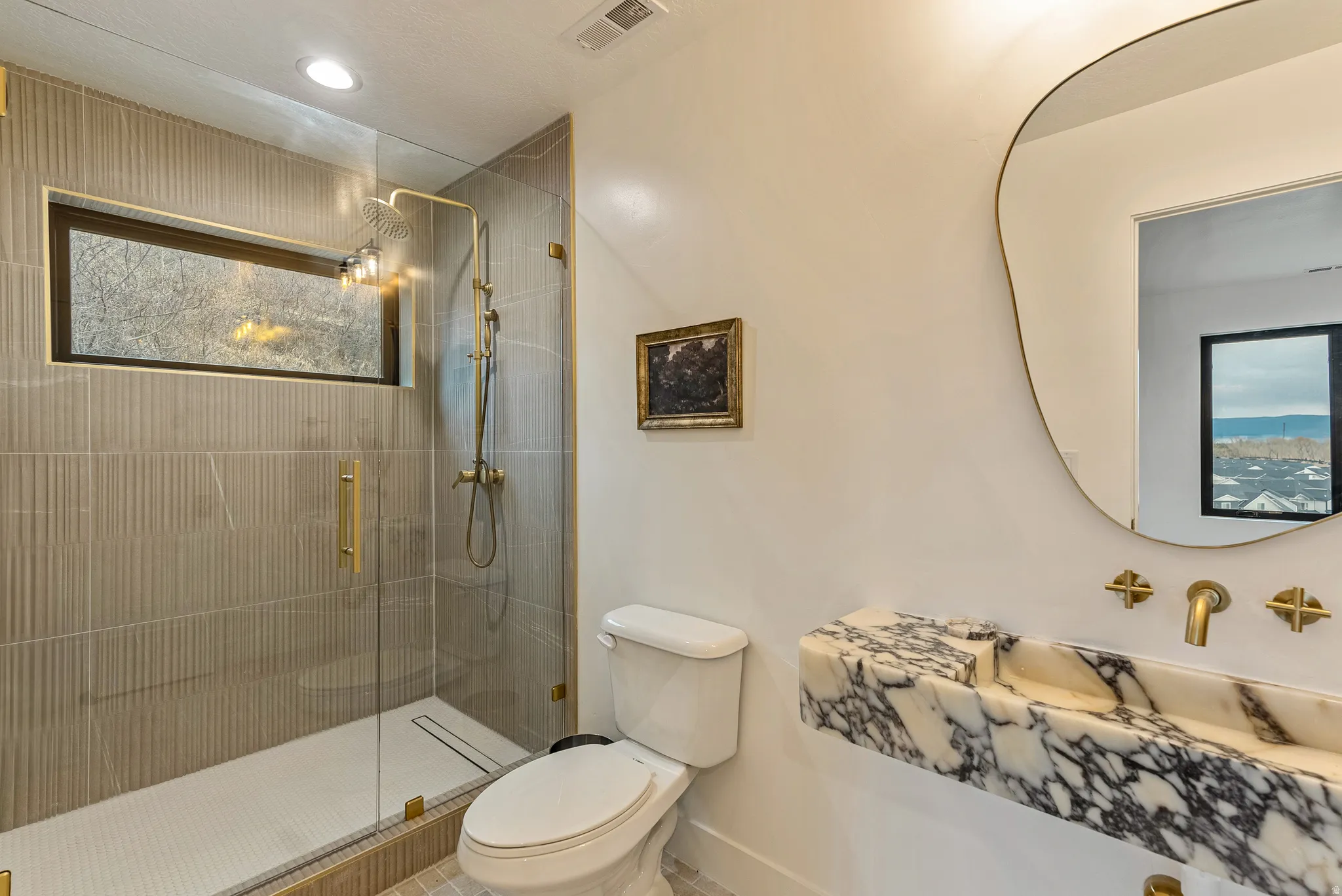 Full bathroom with vanity, a shower stall, and recessed lighting