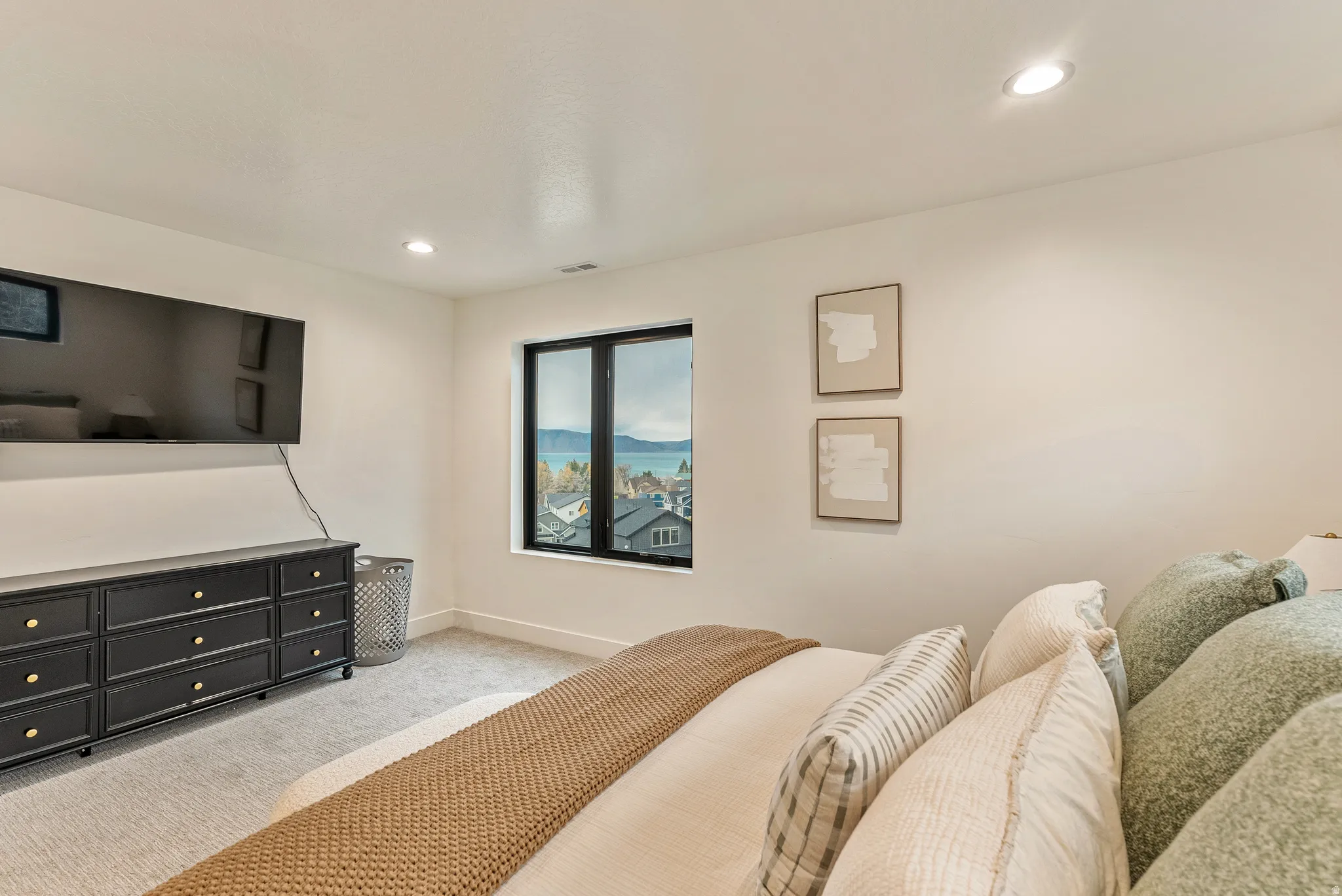 Bedroom with recessed lighting and light carpet