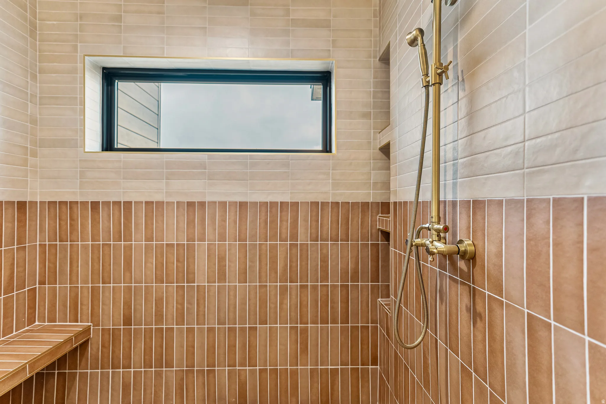 Bathroom featuring a tile shower