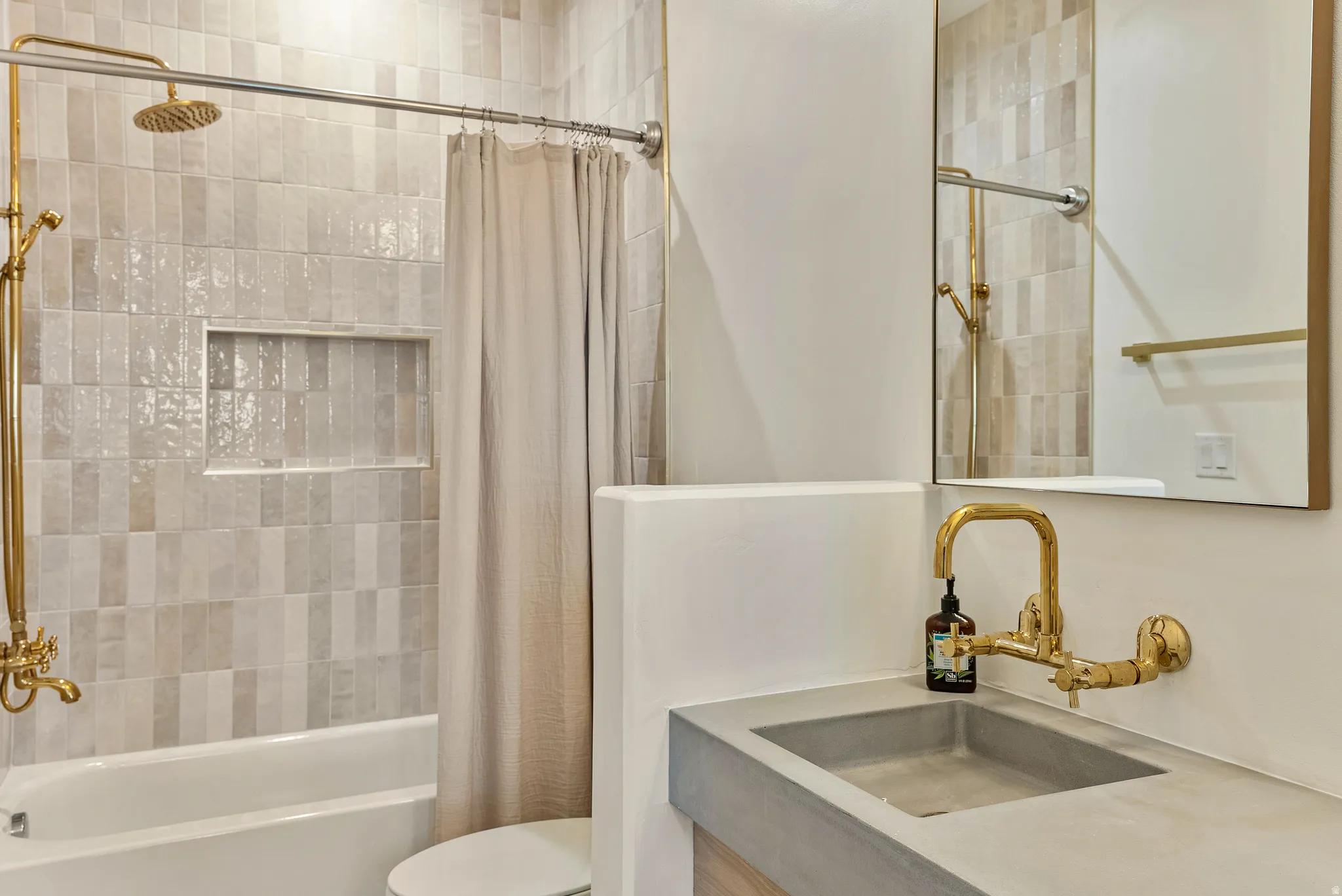 Bathroom featuring vanity and shower / bath combo with shower curtain