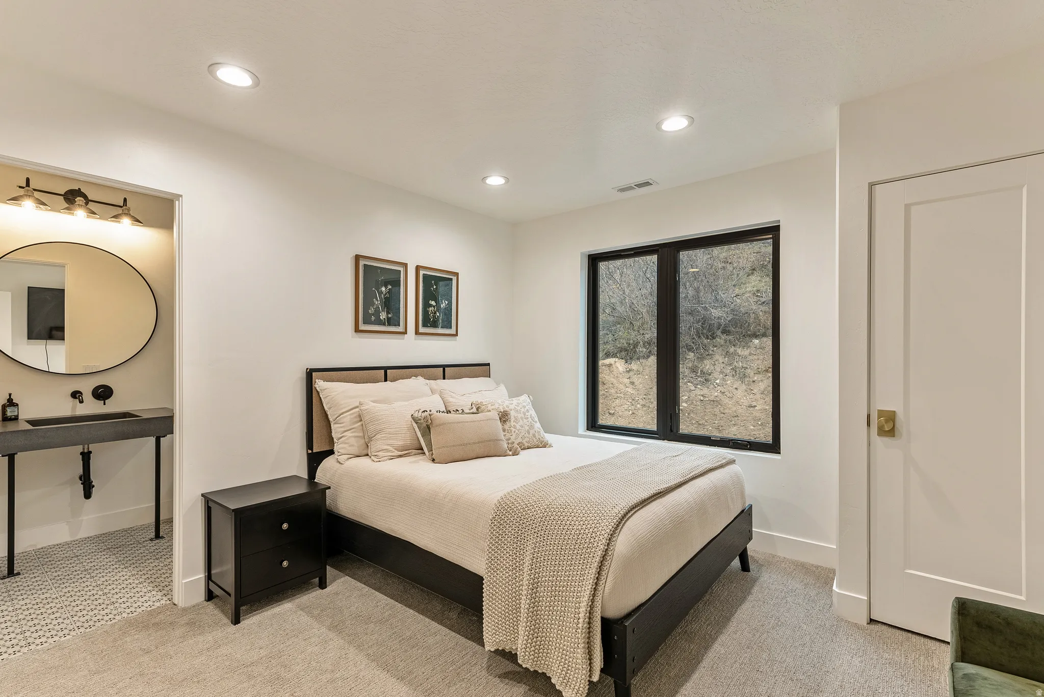 Bedroom with recessed lighting and light colored carpet