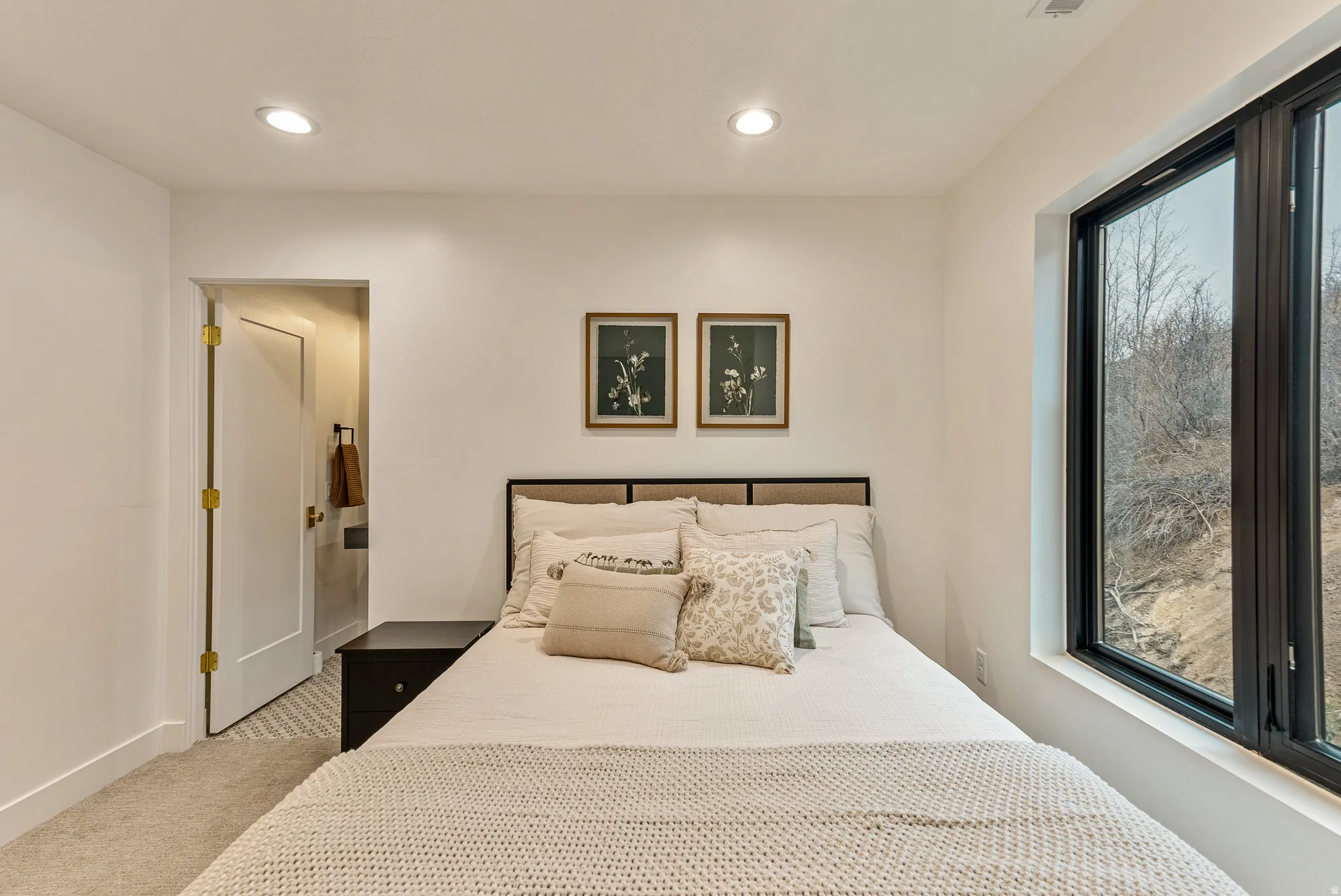 Carpeted bedroom with recessed lighting
