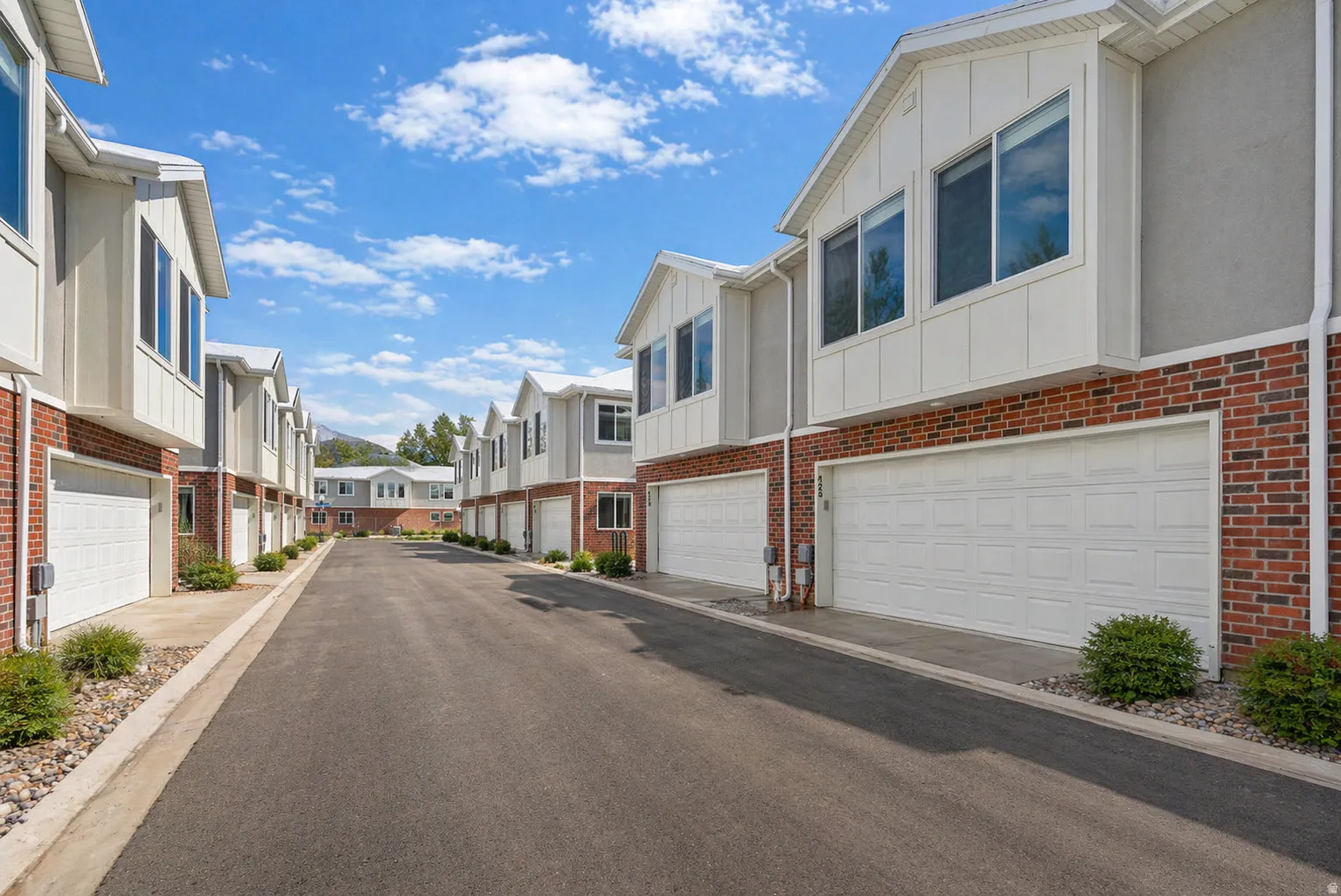 View of asphalt street with a residential view