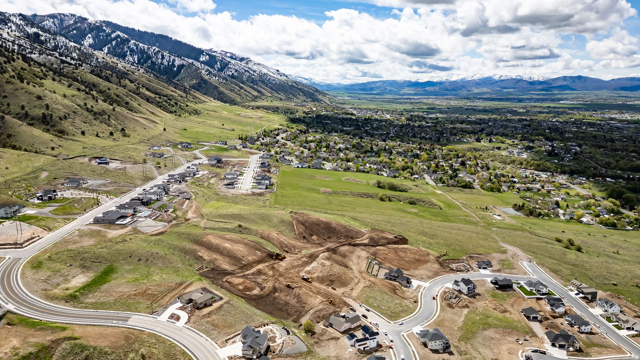 Aerial view of residential area featuring mountains