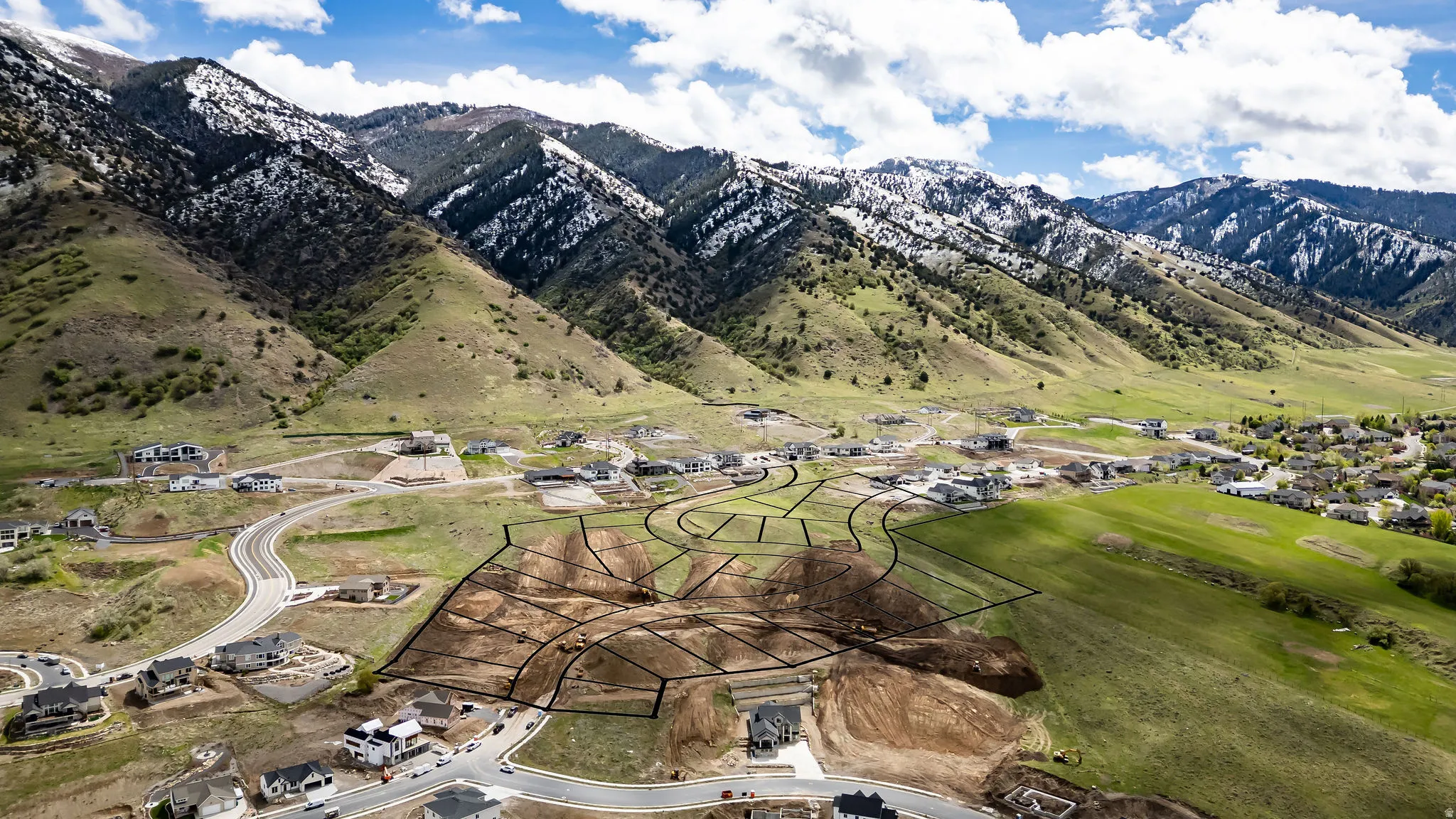 View of mountain backdrop with nearby suburban area
