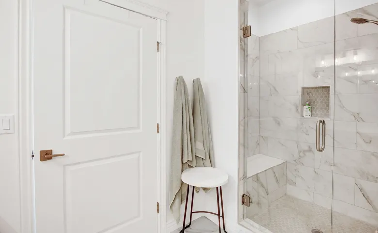 Full bathroom featuring a marble finish shower
