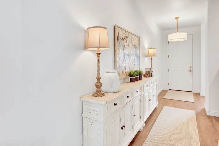 Entrance foyer with light wood-style floors and baseboards