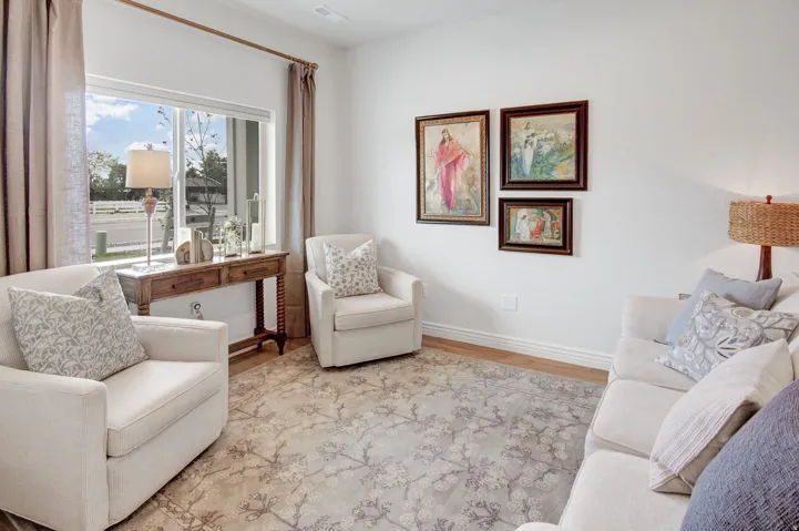 Living area featuring baseboards and wood finished floors