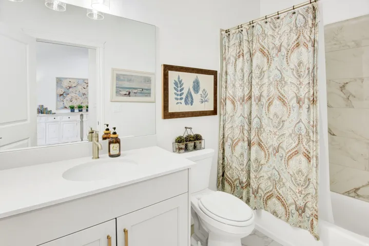 Full bath with vanity and shower / bathtub combination with curtain