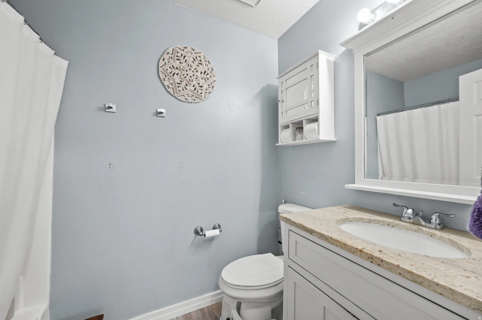 Private Master Bathroom featuring a shower over tub and vanity