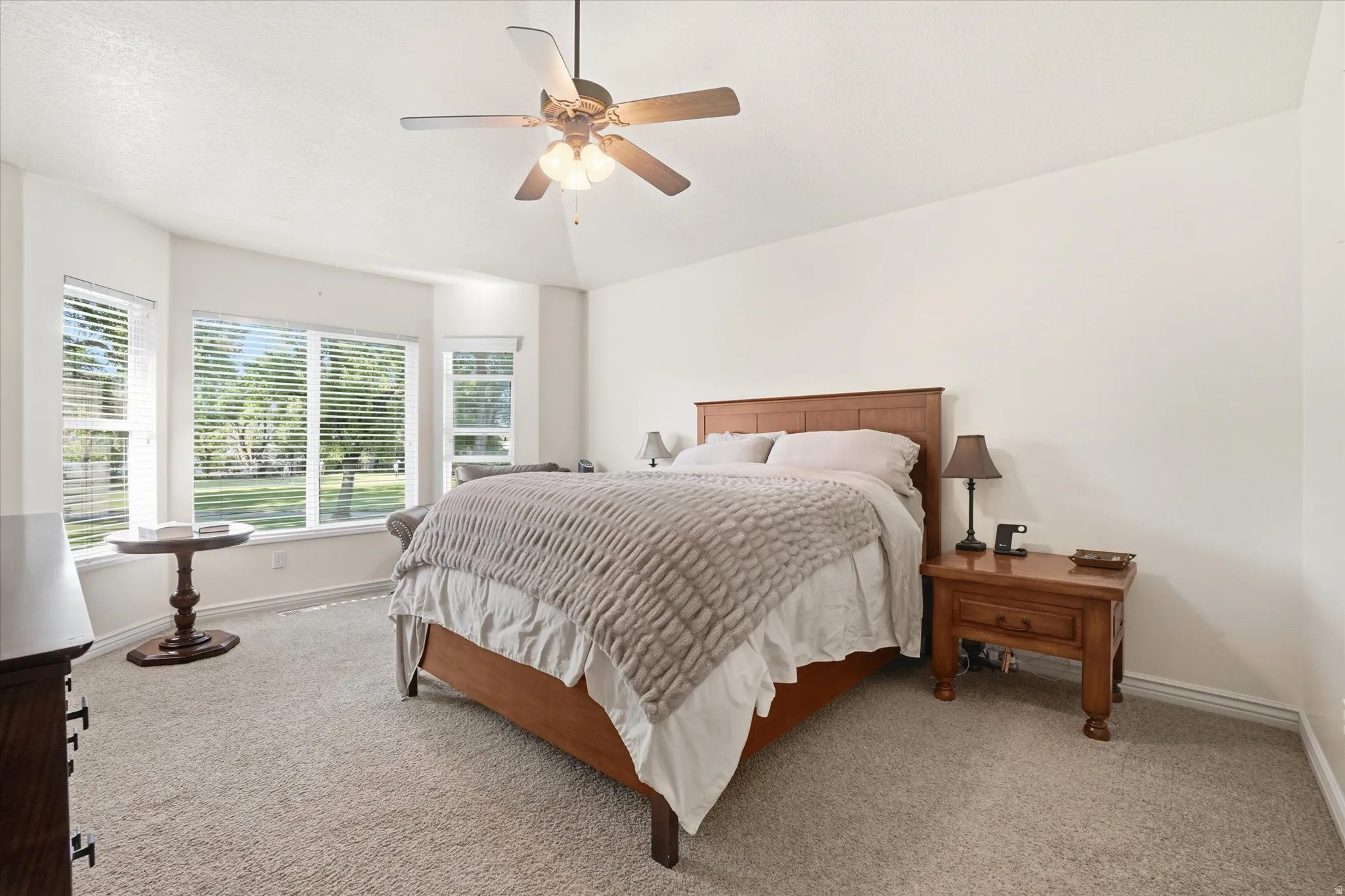 Expansive room featuring a bay window with multiple panes, providing natural illumination