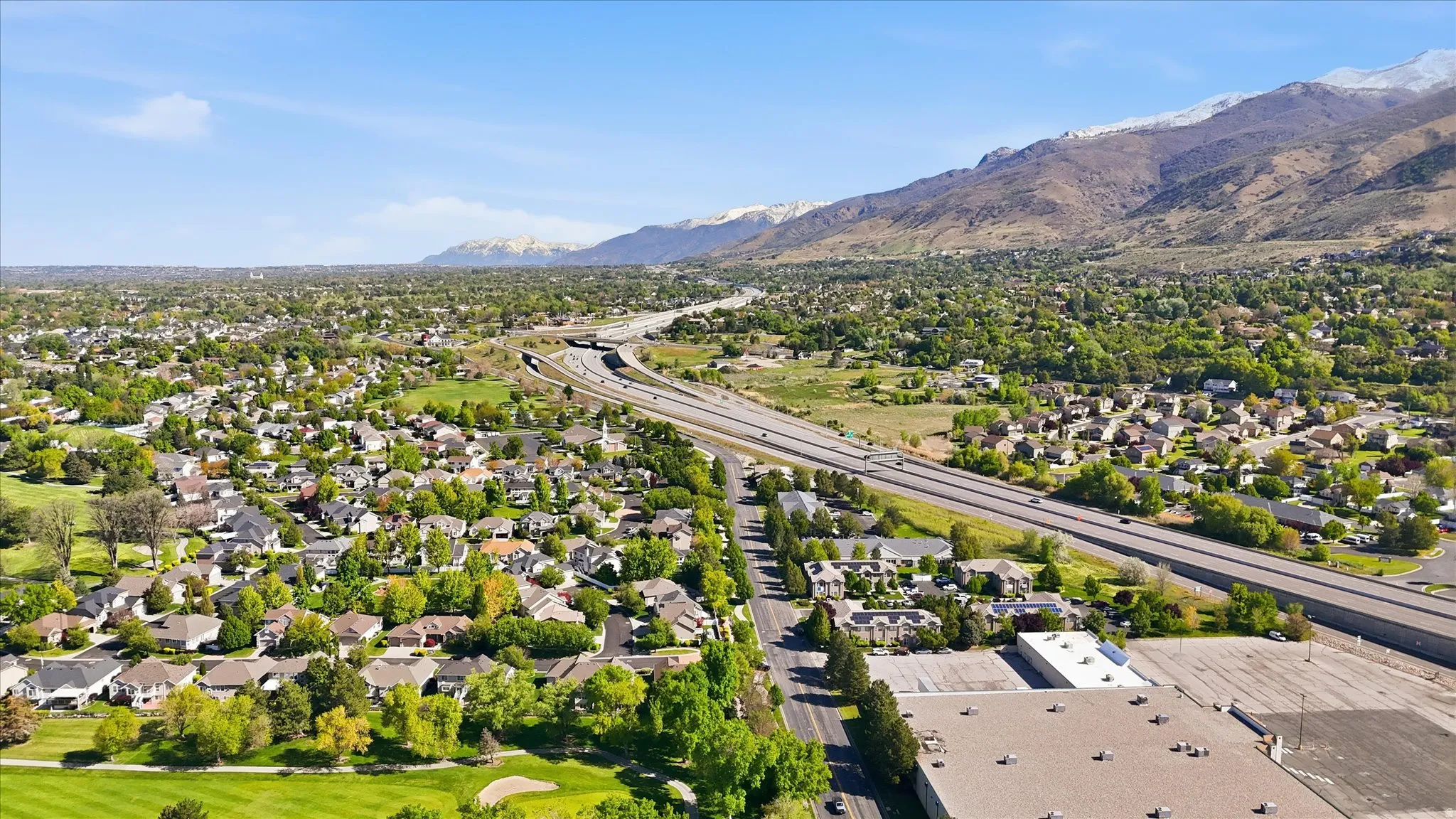 Aerial view of residential area with a mountain backdrop