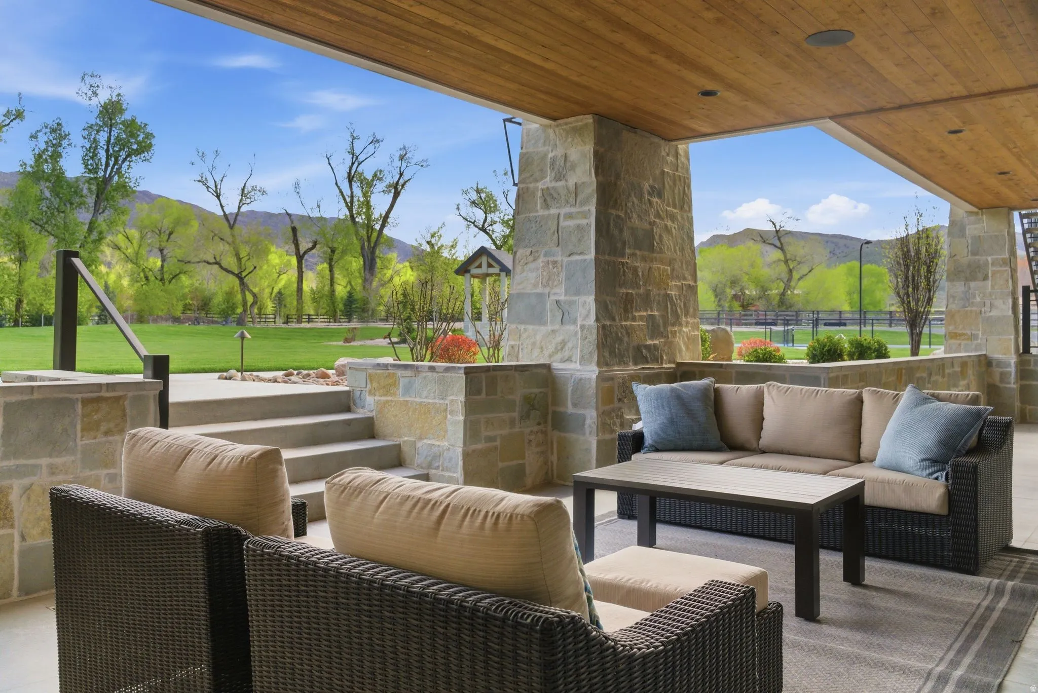 View of patio with a mountain view and outdoor seating