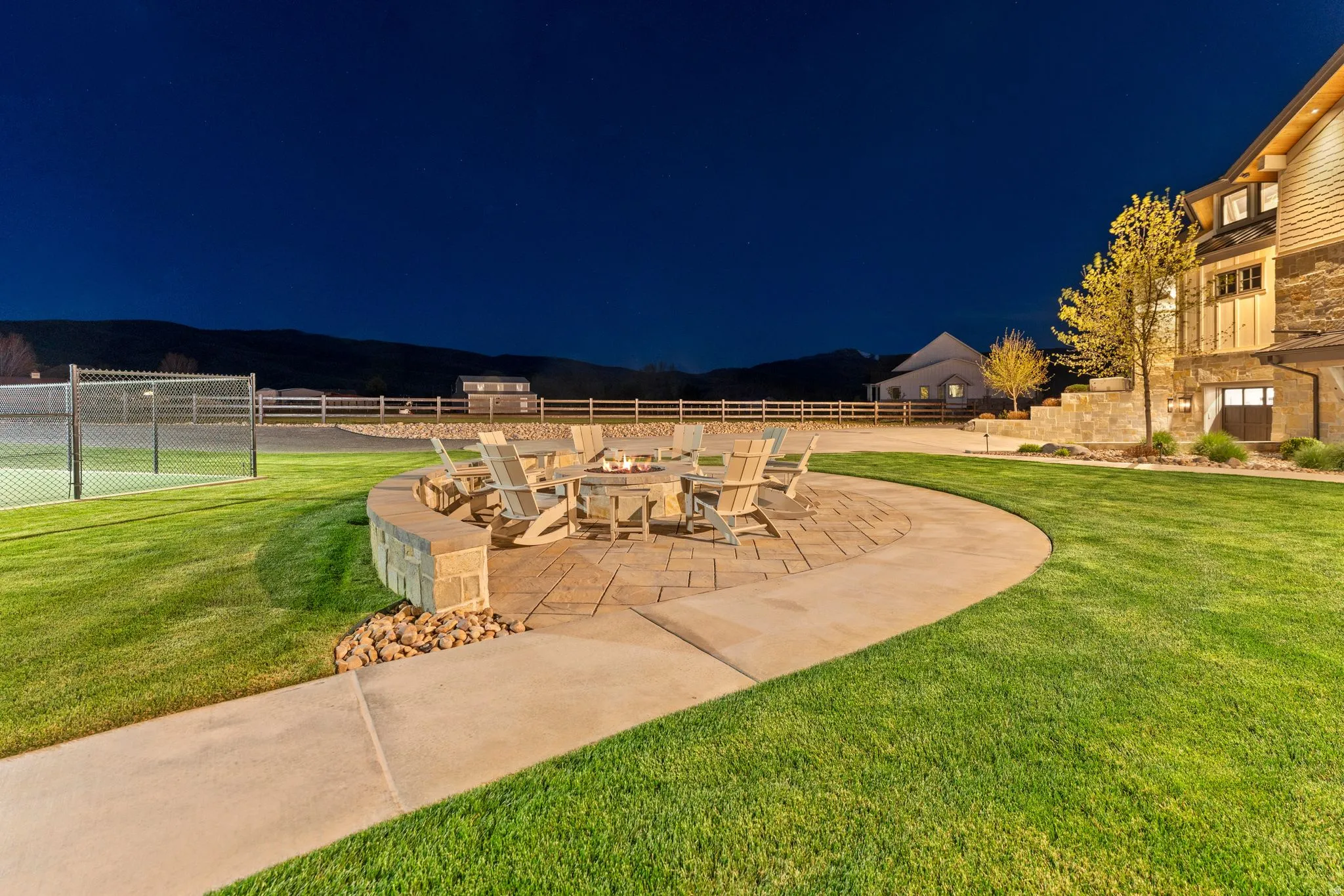 Patio at twilight featuring a fire pit and a patio