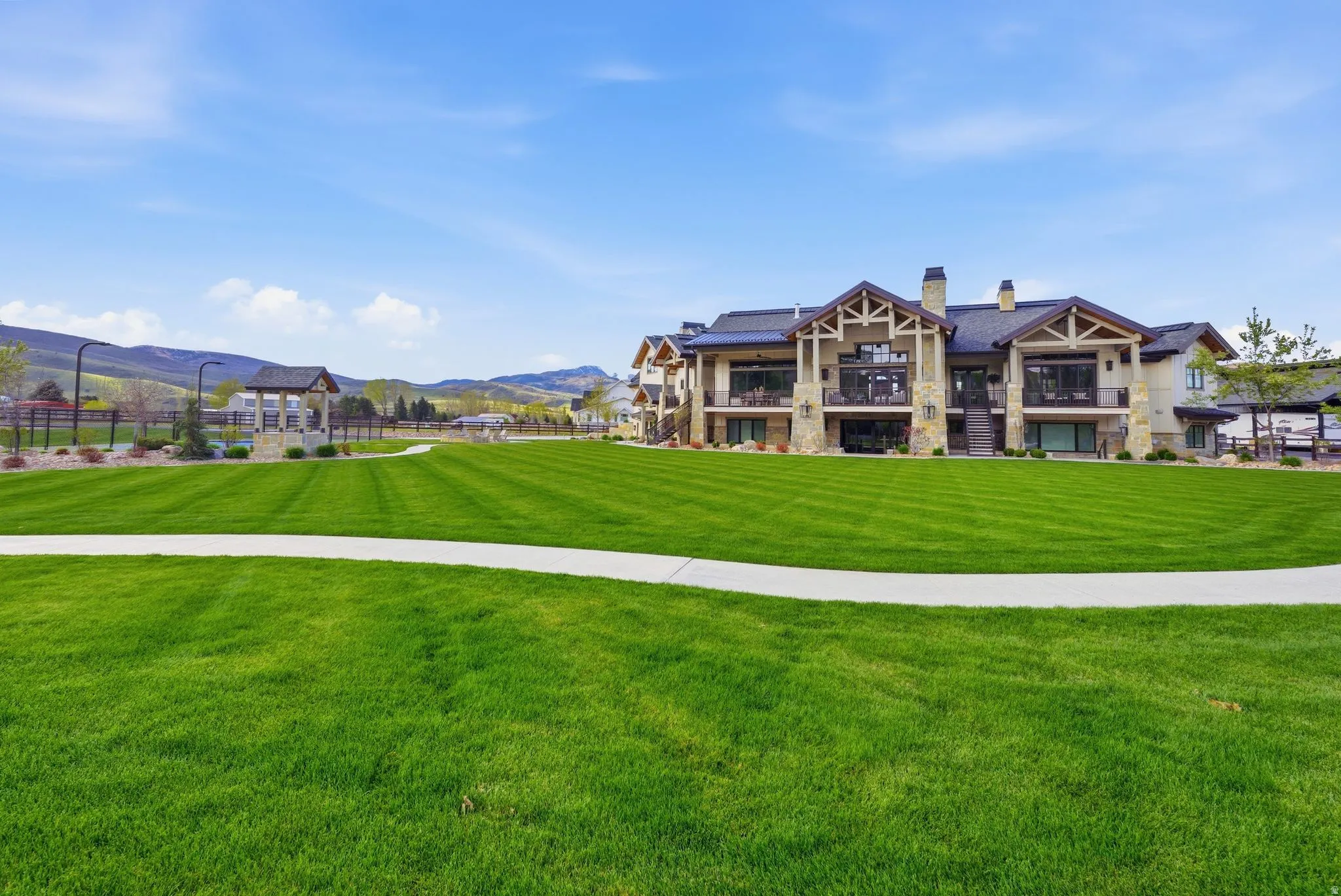 View of home's community featuring a mountain view and a balcony