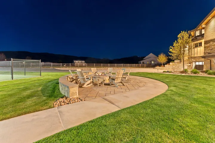 Patio at twilight featuring a fire pit and a patio