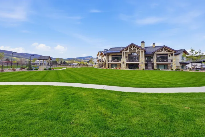 View of home's community featuring a mountain view and a balcony