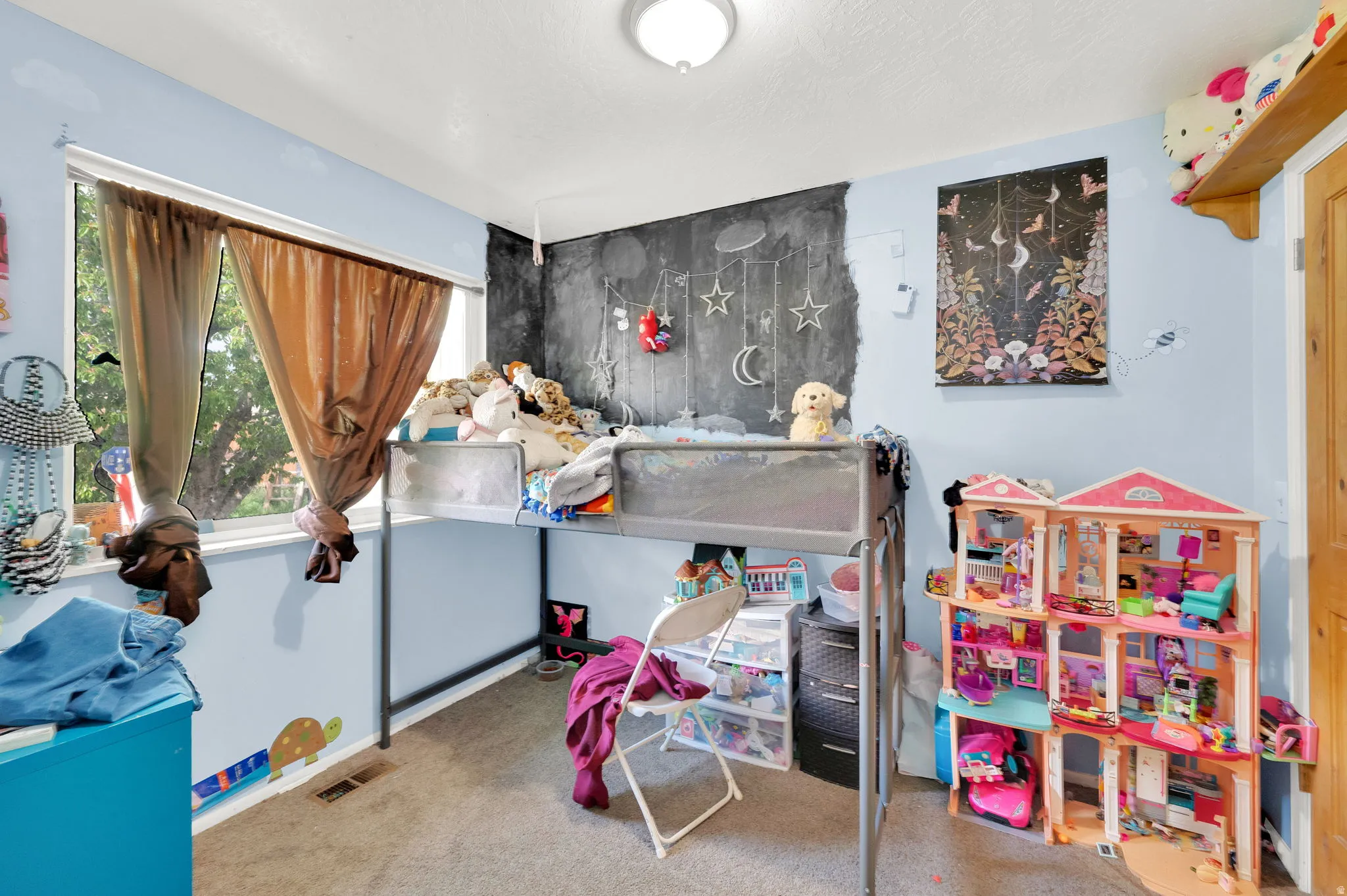 Bedroom featuring light carpet