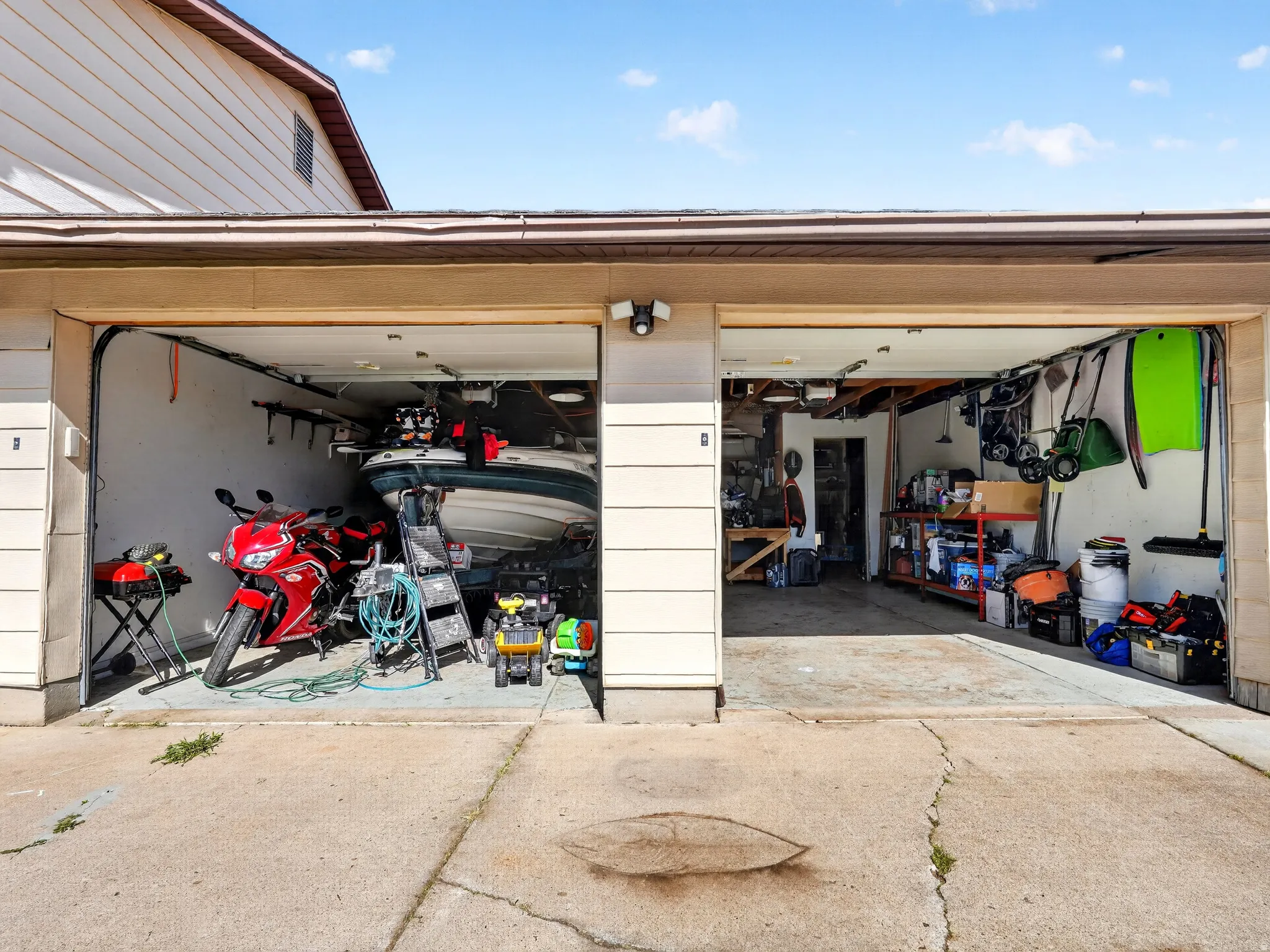Garage featuring concrete driveway