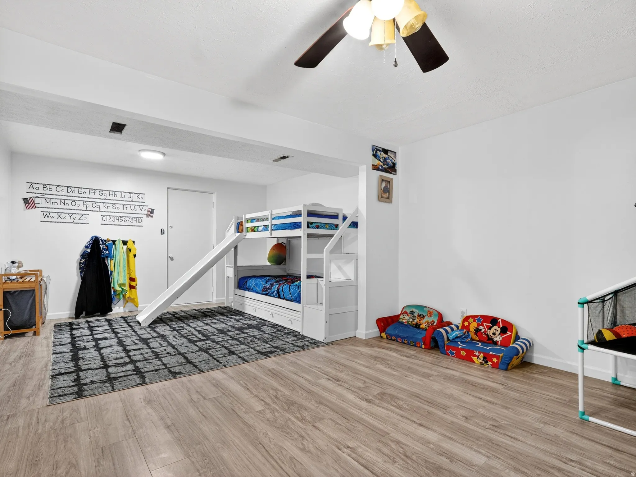 Game room featuring wood finished floors and ceiling fan
