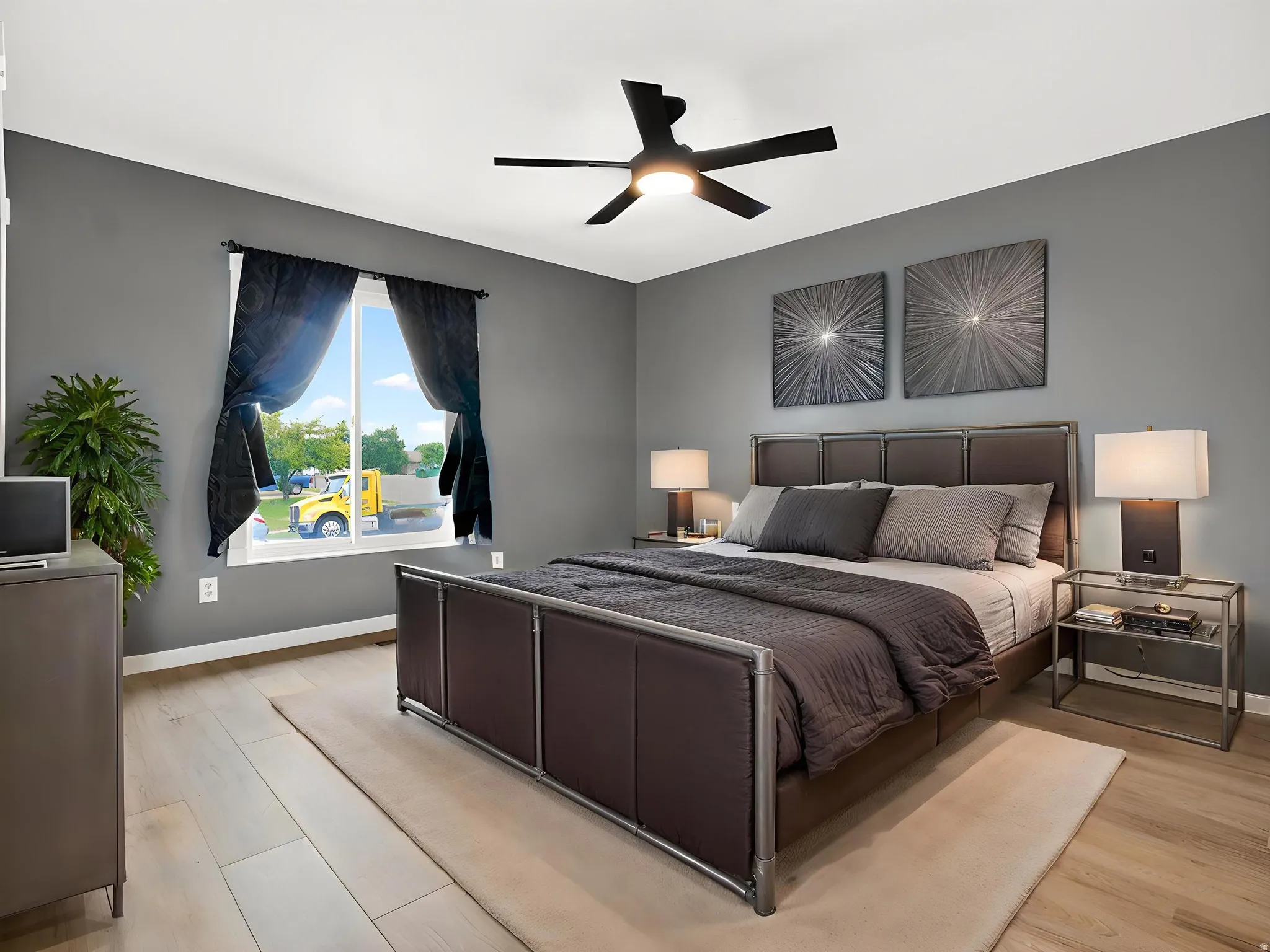 Bedroom with light wood-style flooring and ceiling fan