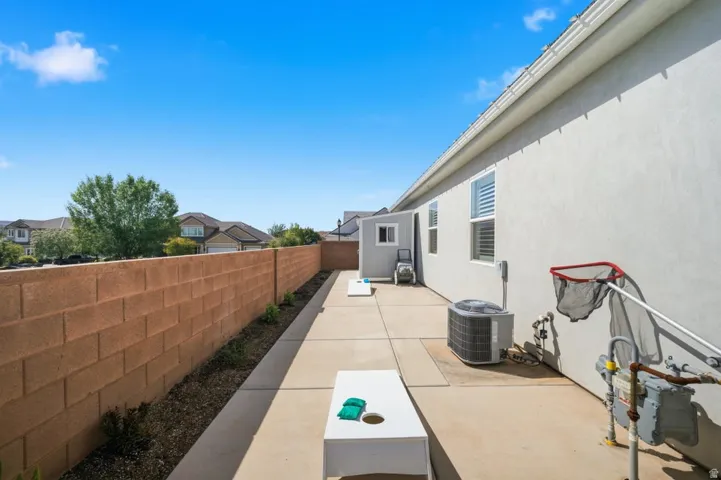 Fenced backyard with a patio
