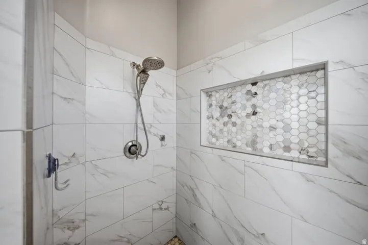 Full bath with a tile shower