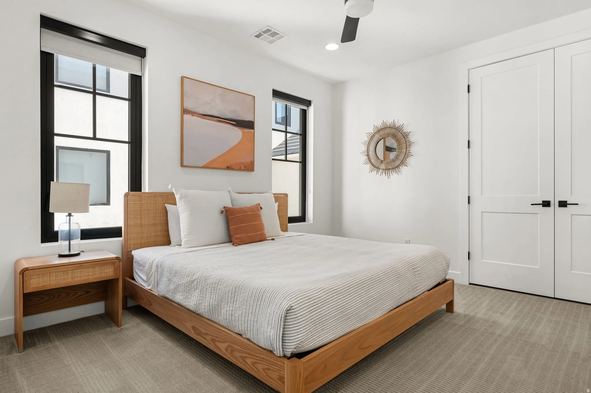 Bedroom featuring light carpet, ceiling fan, and recessed lighting