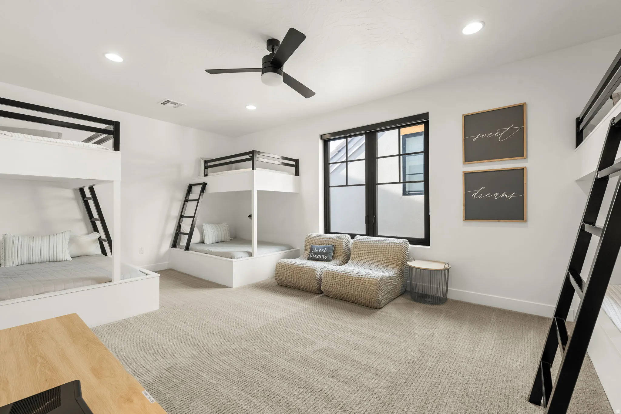 Bedroom featuring light colored carpet, ceiling fan, and recessed lighting