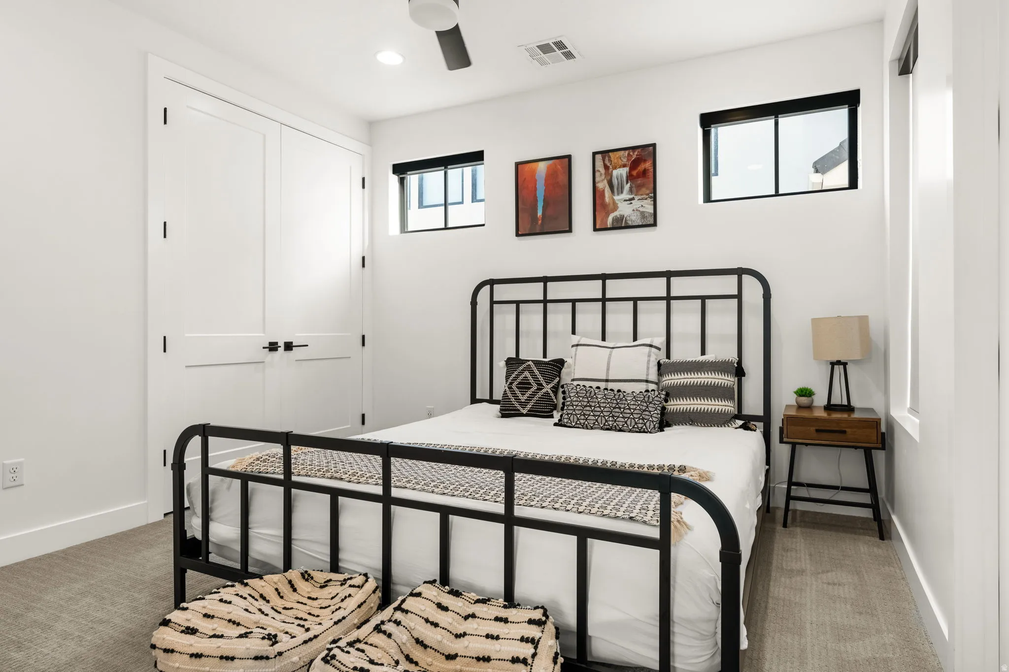 Bedroom featuring light colored carpet, a ceiling fan, a closet, and recessed lighting