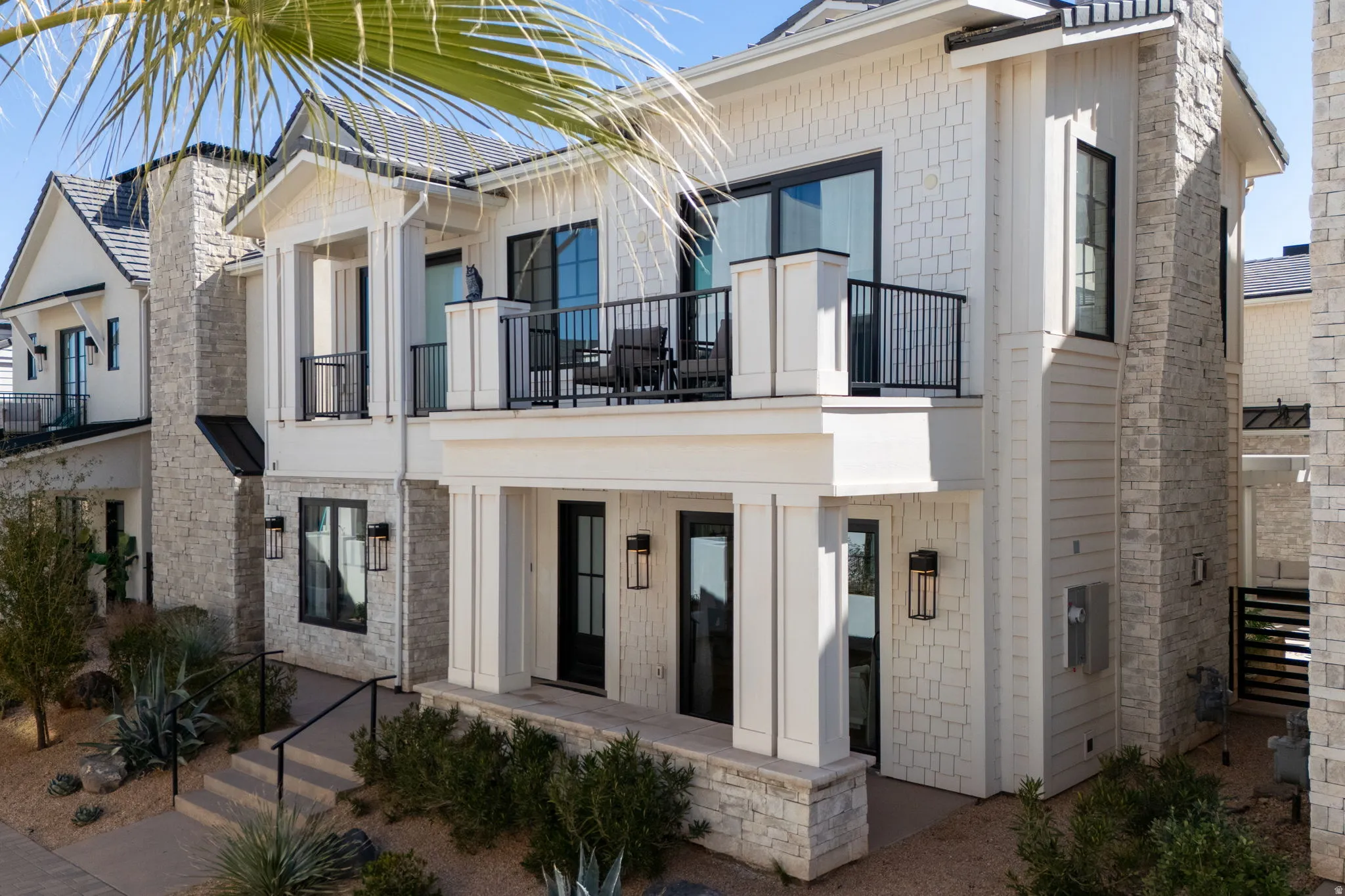 View of front of house with a balcony