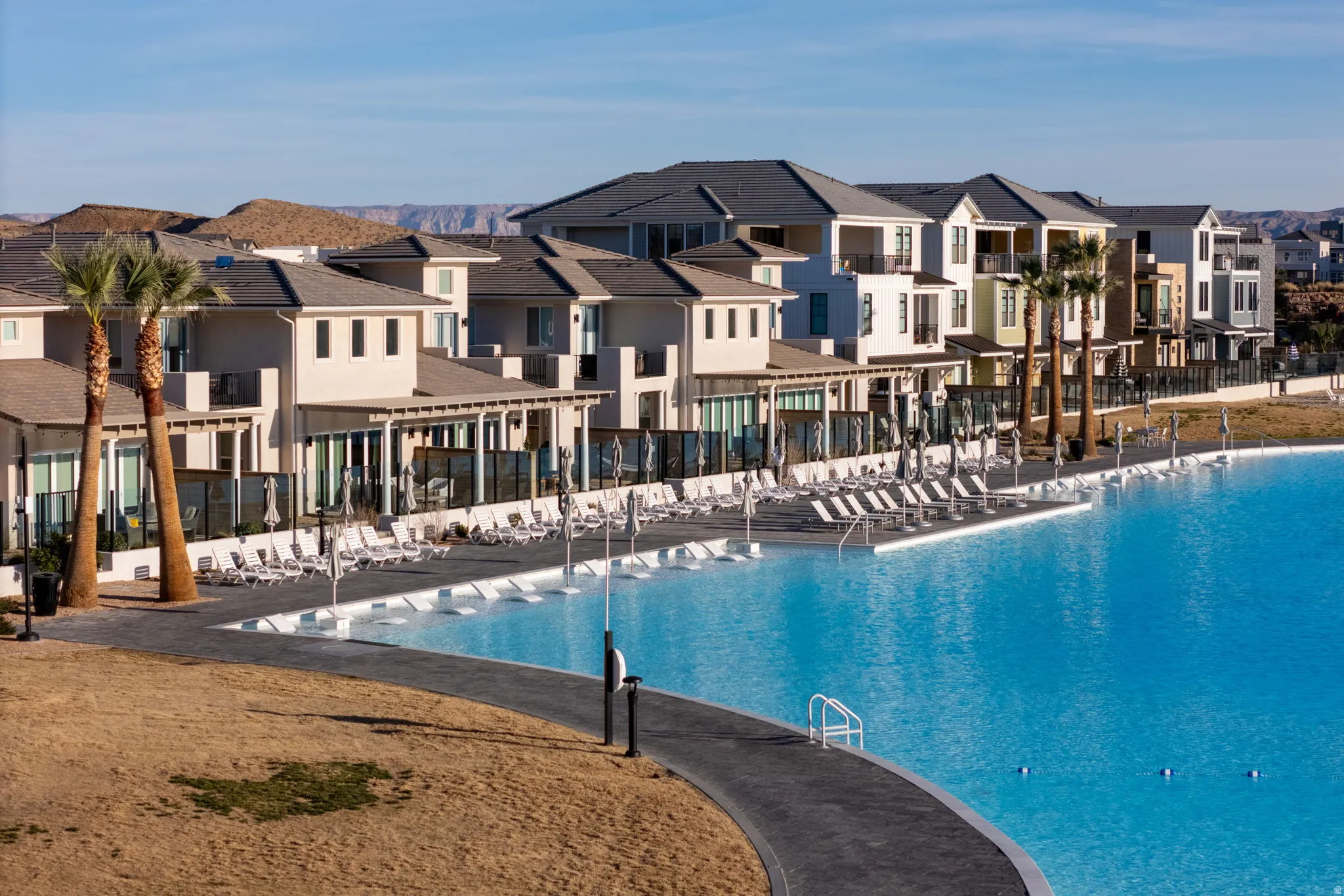 Community pool featuring a residential view